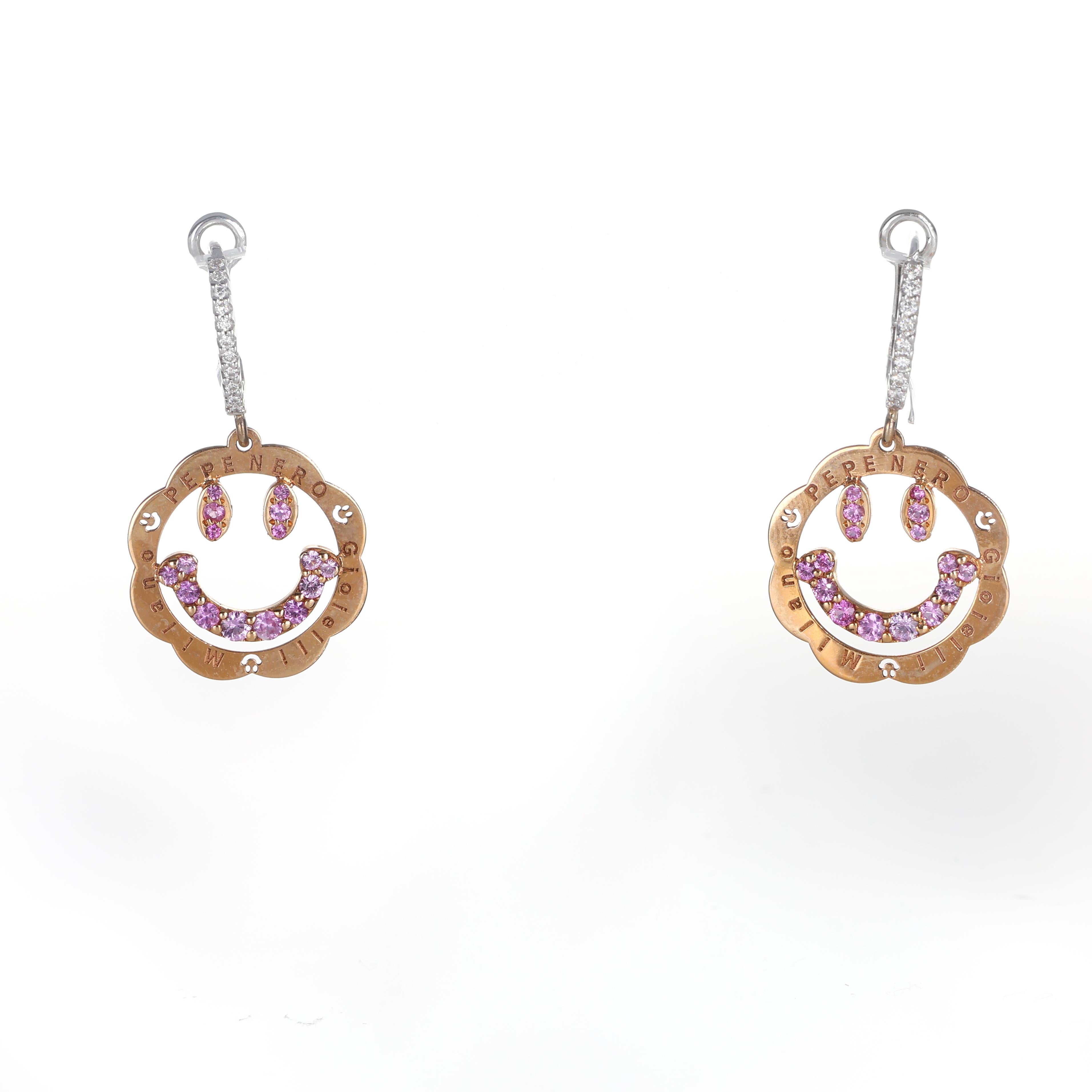 Playful and refined, these dangle earrings are crafted in 18K white and rose gold, featuring a whimsical smiley face motif within a delicate floral frame. The white gold hooks are set with round brilliant-cut diamonds, while the central smiley face