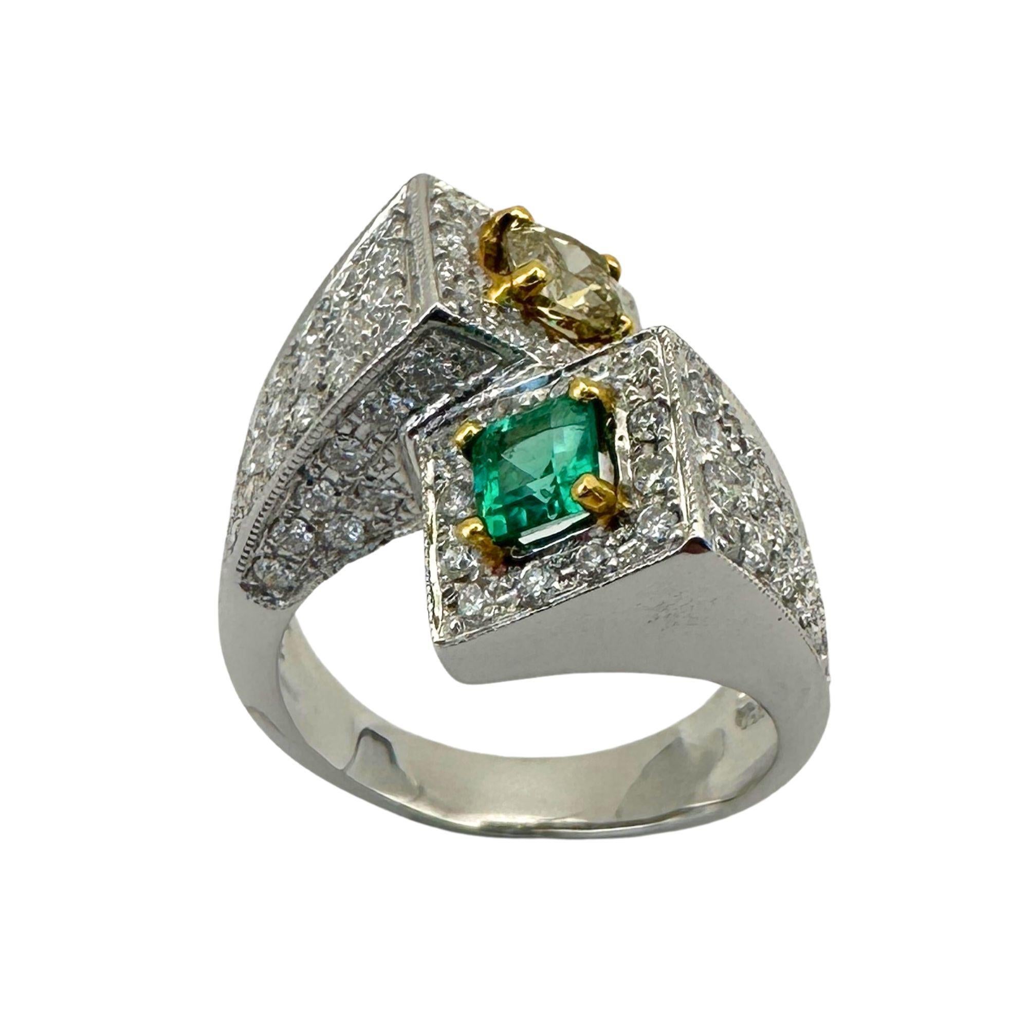Indulge in luxury and elegance with our 18k White and Yellow Diamond and Emerald Ring. The stunning combination of diamonds and vibrant emerald gemstone make this ring a true statement piece. The emerald weighs 0.34 carats while the yellow diamond