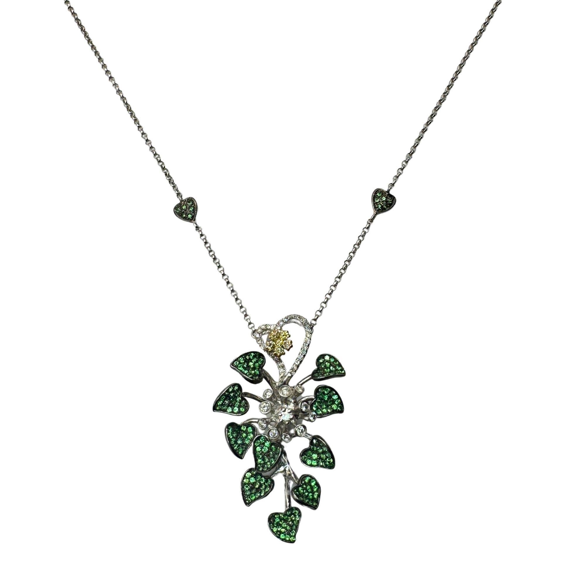Add a touch of elegance with this 18k White and Yellow Diamond and Green Garnet Necklace. The 15.5 inch chain beautifully showcases a 1.75 inch pendant, totaling 17.25 inches in length. With a total weight of 13.57 grams, this necklace is crafted in