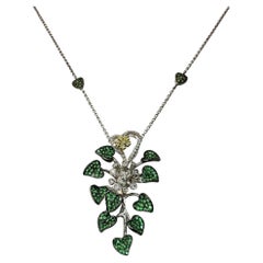 Halskette aus 18 Karat weißem und gelbem Diamant und grünem Granat