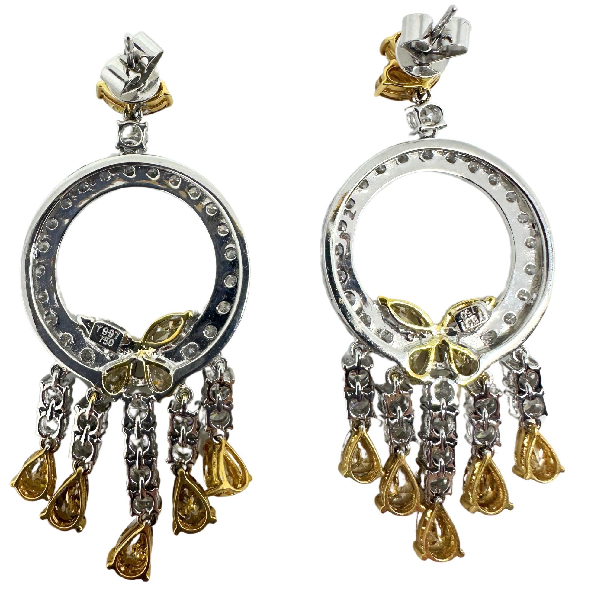 Showcasing 18K White and Yellow Diamond Earrings. Featuring 3.98 carats of yellow diamonds and 5.40 carats of white diamonds in a 18k yellow and white gold setting.

18K White and Yellow Diamond Earrings
Condition: In good condition with some minor
