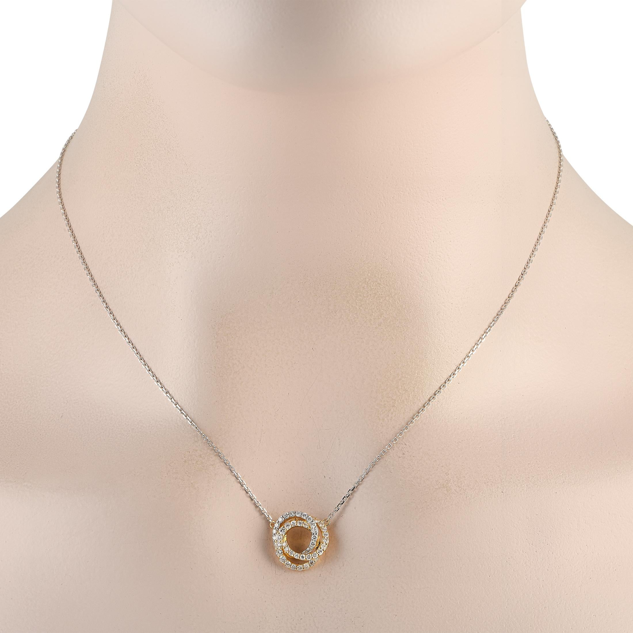 An instant stand-out, this necklace can add a sophisticated flair to your wardrobe. It is made from 18K white and yellow gold and has three interlocking rings for its pendant. Each ring is outlined with round diamonds for a captivating