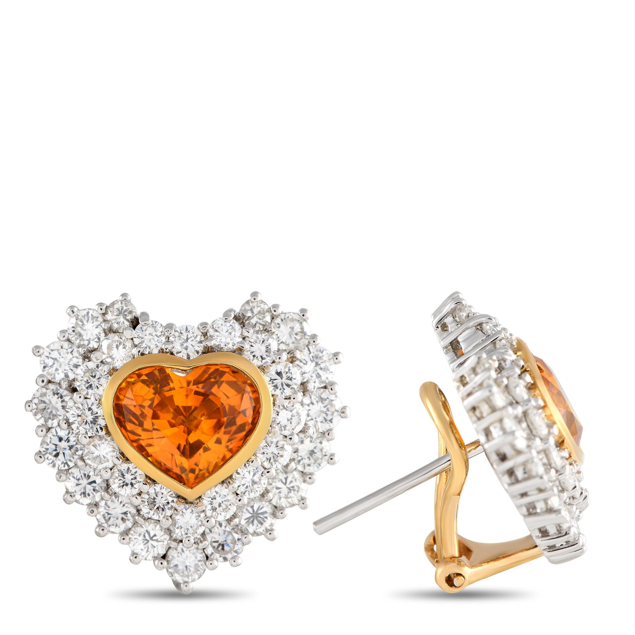 True romantics will instantly fall in love with the elegant glow of these earrings. They feature a gorgeous heart-shaped sapphire set on an 18K yellow gold bezel. Surrounding the faceted gem are tiny round diamonds that also form a heart silhouette.