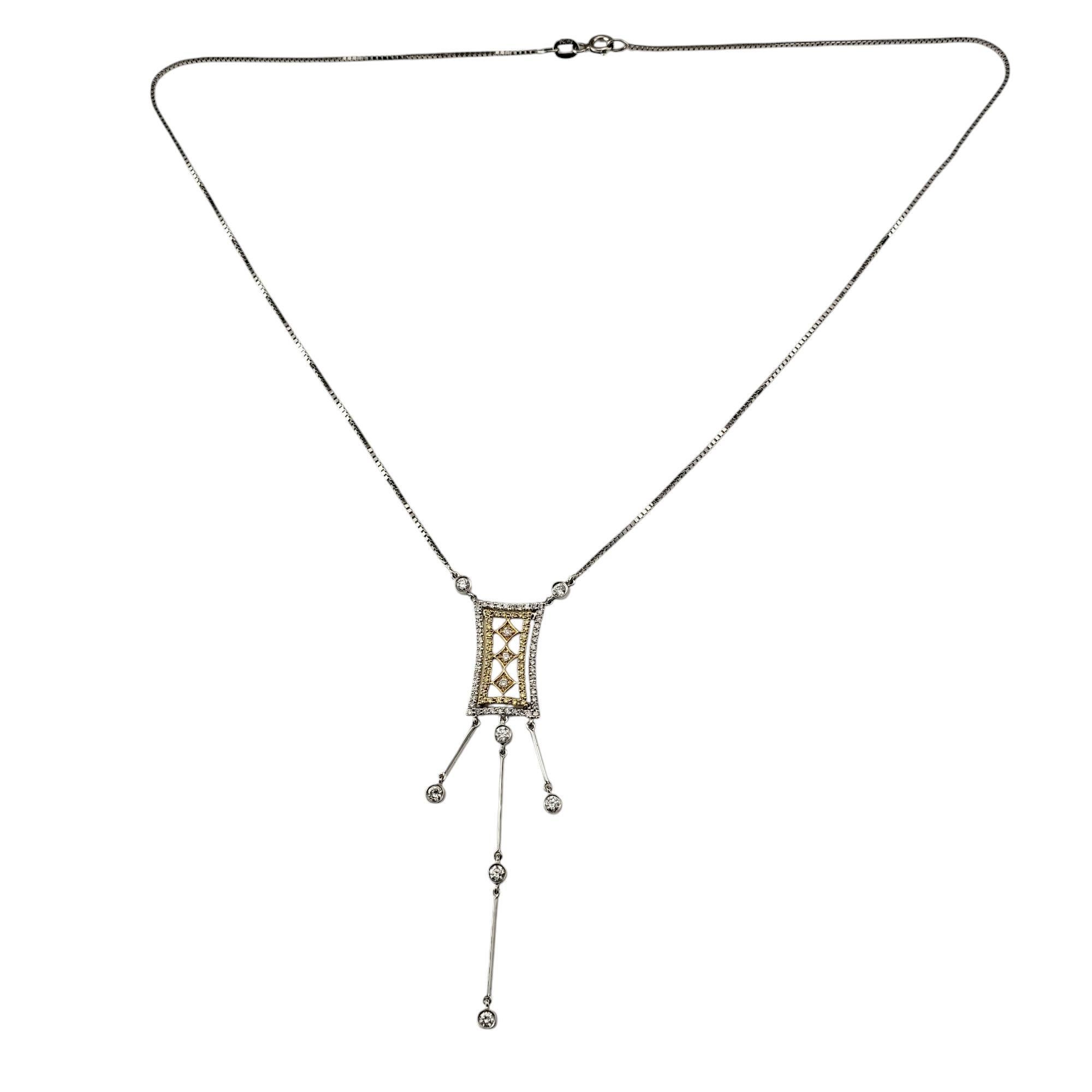 18 Karat White and Yellow Gold and Diamond Art Deco Style Pendant Necklace-

Radiating vintage-inspired elegance, this stunning pendant necklace is a stunning work of craftsmanship. Adorned with 91 sparkling white and yellow diamonds set in
