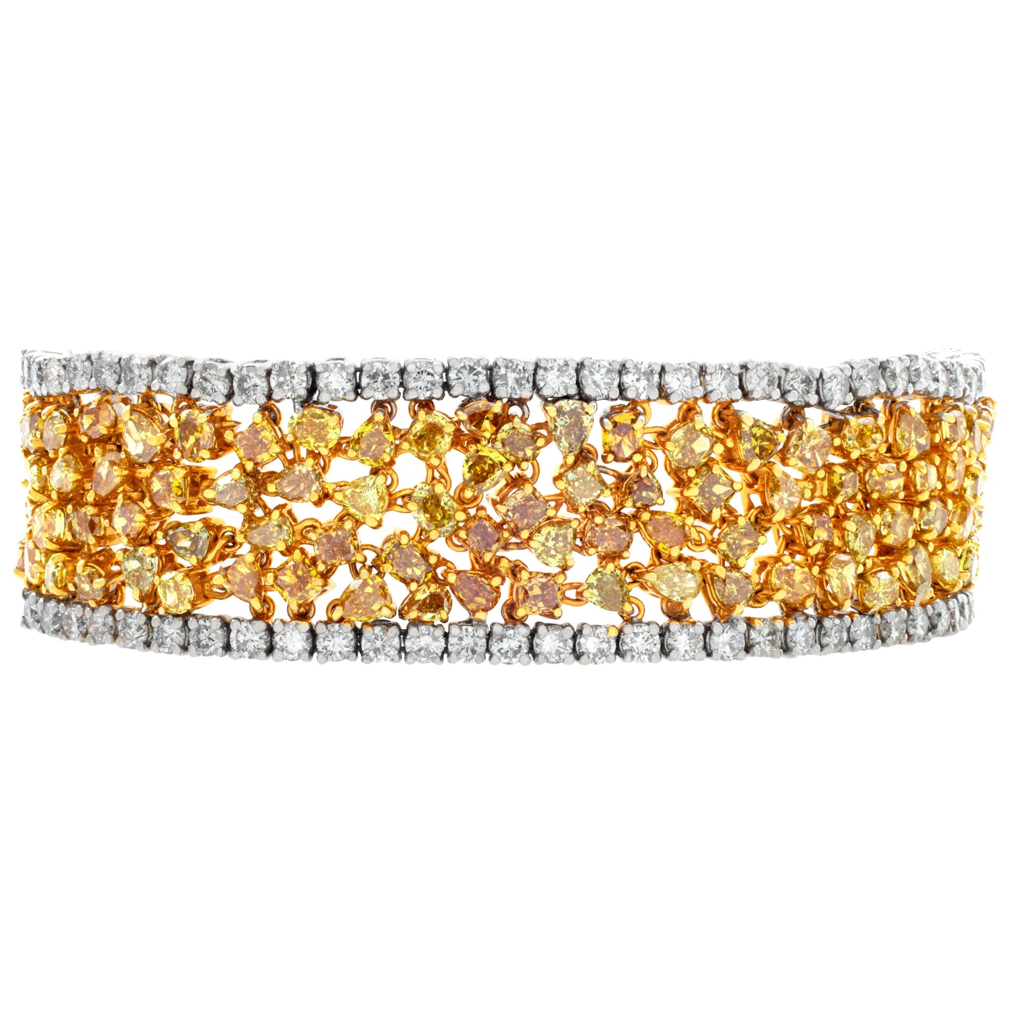 Stunning 18k yellow and white gold sparkly wide bracelet with 32.13 carats in miscellaneously cut fancy diamonds and white diamonds. Fit for 7'' wrist, 20mm wide.
