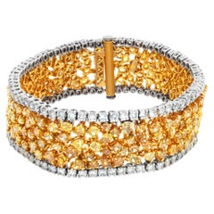 18k white and yellow gold bracelet with white and fancy diamonds
