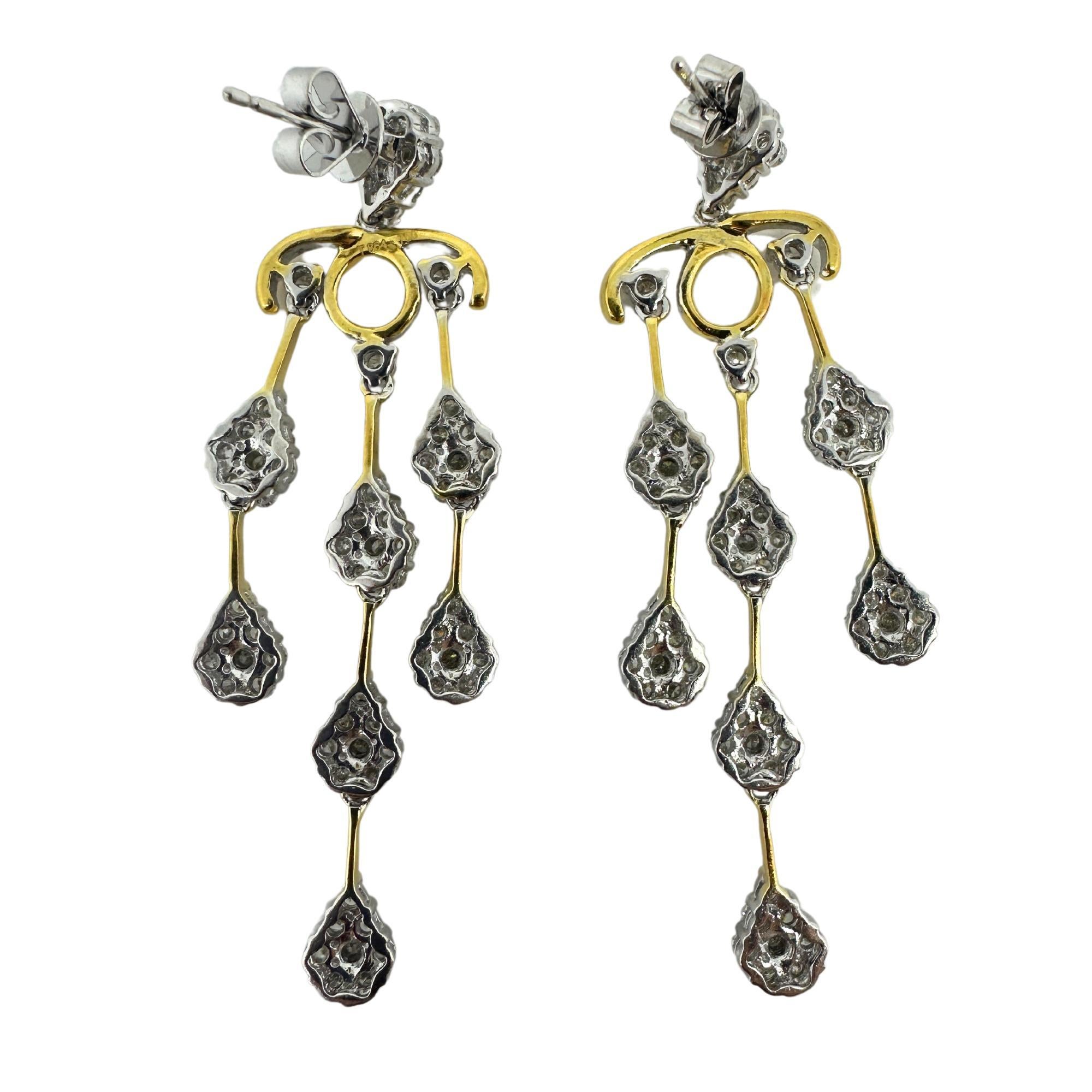 Showcasing these stunning modern 18K White and Yellow Gold Diamond Earrings, 2.25 inches in length. Earrings consist of 18K white gold and 3.56 carats of diamonds.
18K White and Yellow Gold Diamond Earrings
Condition: In good condition with some