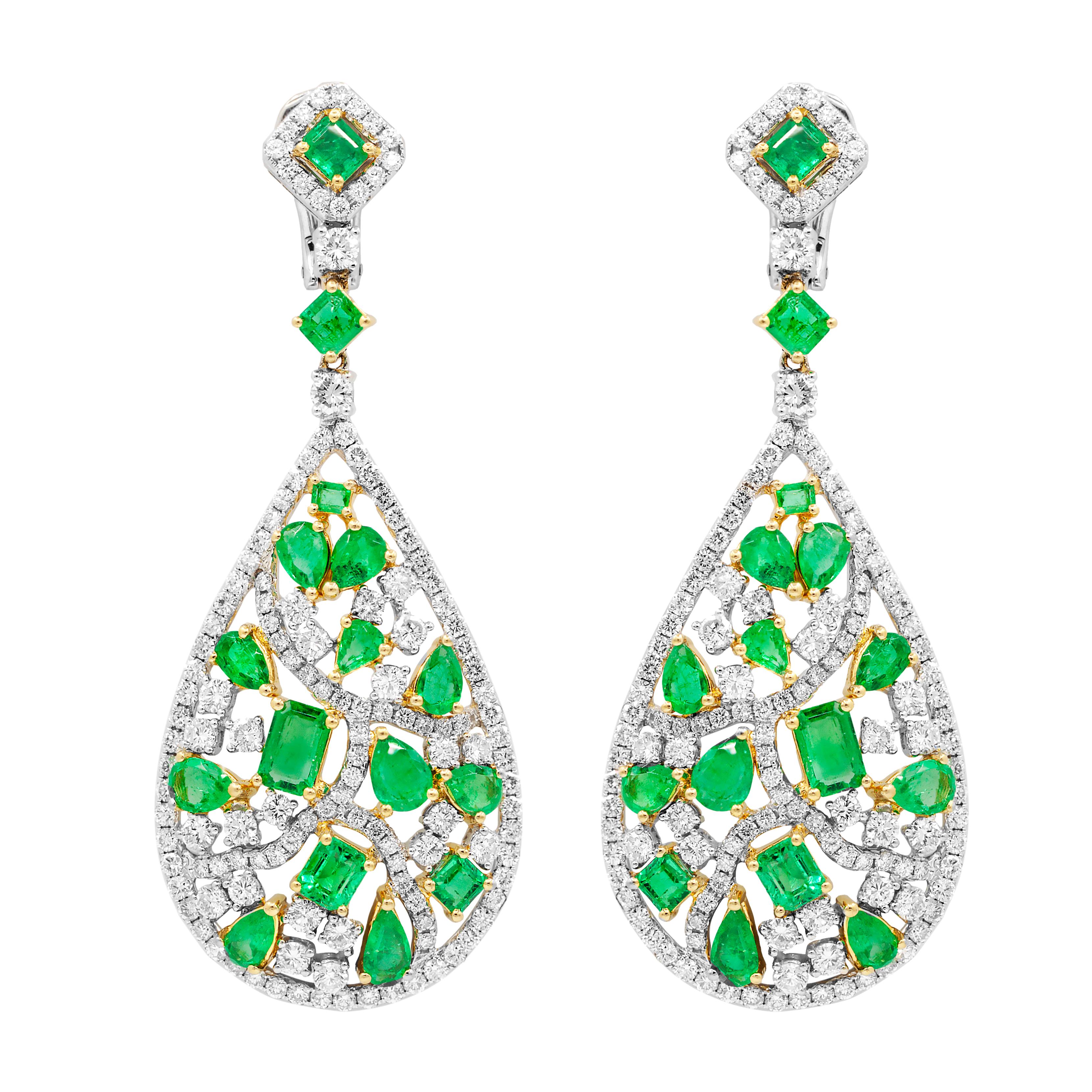 18k white and yellow gold emerald earrings features 10.00 carats of green emeralds and 8.75 carats of diamonds creating a tear dl.Drop design
