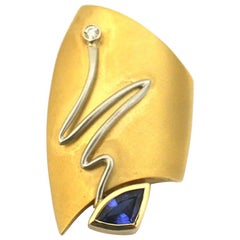 18k White and Yellow Gold Fashion Brooch by “Susan” with Tanzanite and Diamond