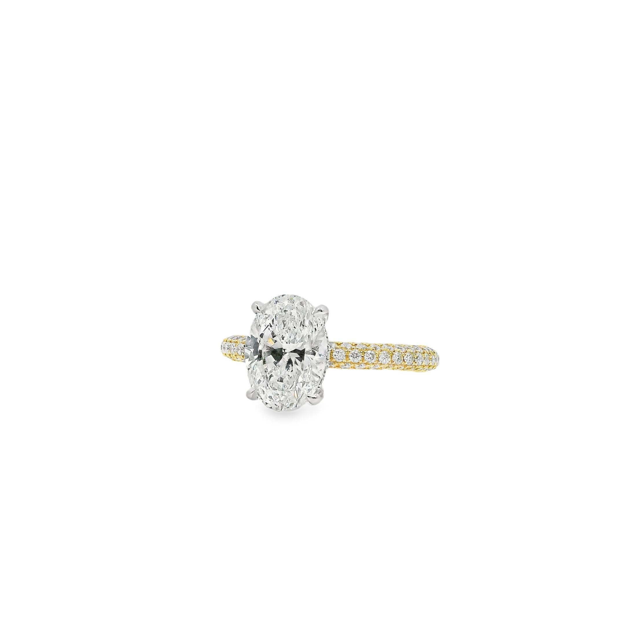 This extraordinary 18k white and yellow gold engagement ring showcases a breathtaking 2.01-carat oval-cut natural diamond, certified by GIA (#5232495789) for exceptional quality. Graded G in color and SI2 in clarity, the center diamond displays