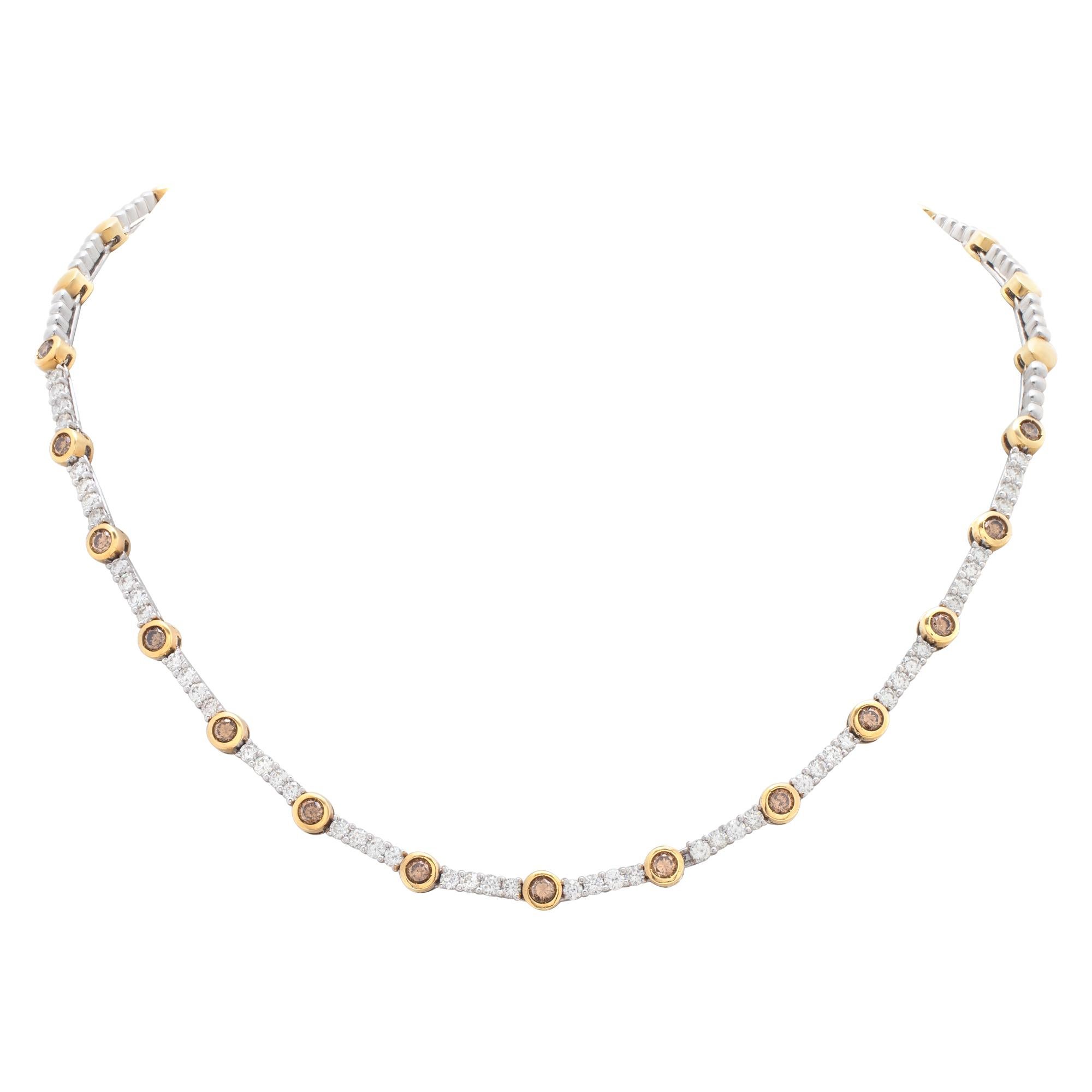 Stunning 18k white and yellow gold necklace with approximately 2.08 carats in white diamonds and 1.40 carats in champagne diamonds. Length 16'', width 2.5mm - 4mm.