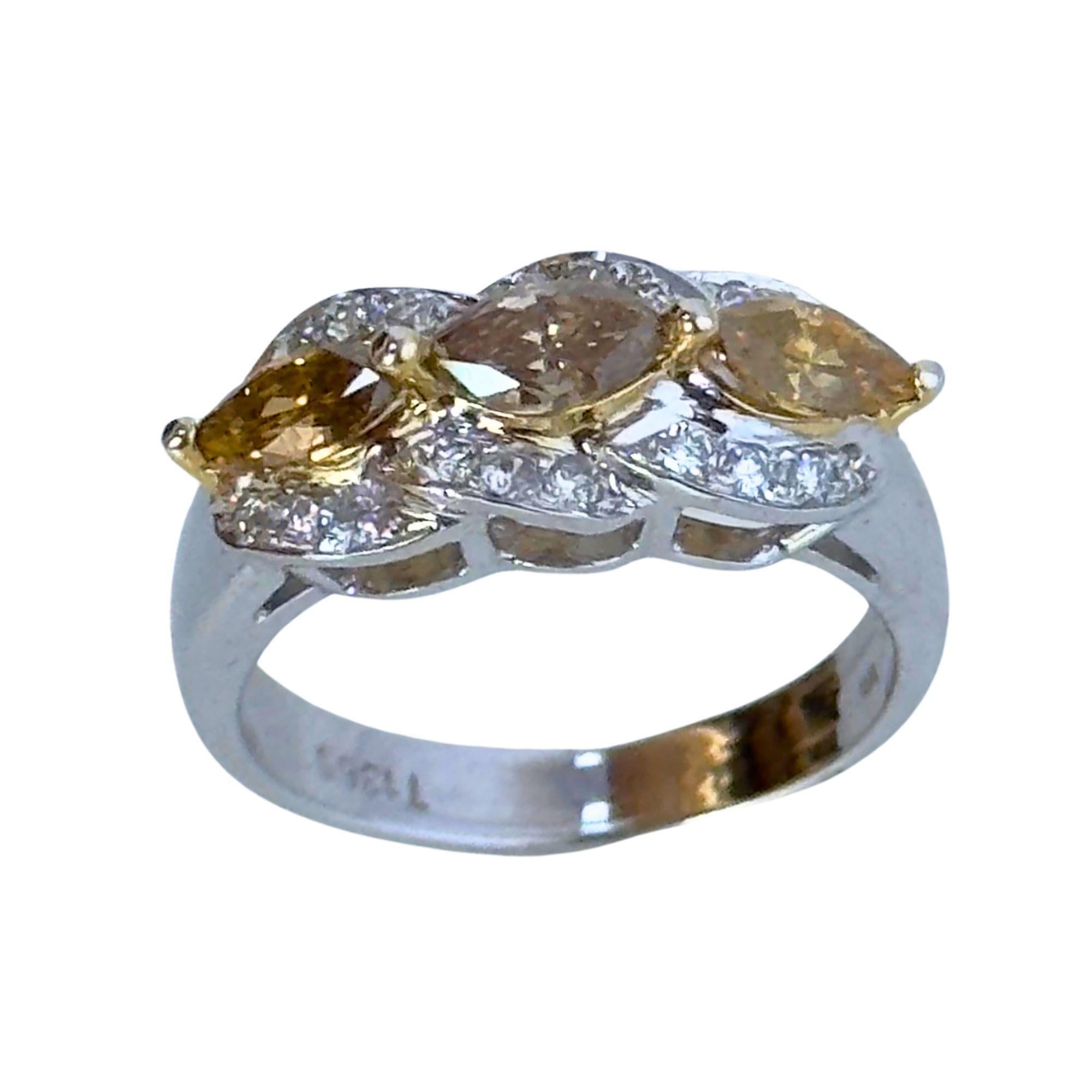 Introducing the 18k White and Yellow Marquise Diamond Ring. This ring features marquise-shaped white diamonds weighing 0.23 carats, accompanied by vibrant marquise yellow diamonds weighing 0.89 carats.

Crafted in a size 6, this ring is designed to
