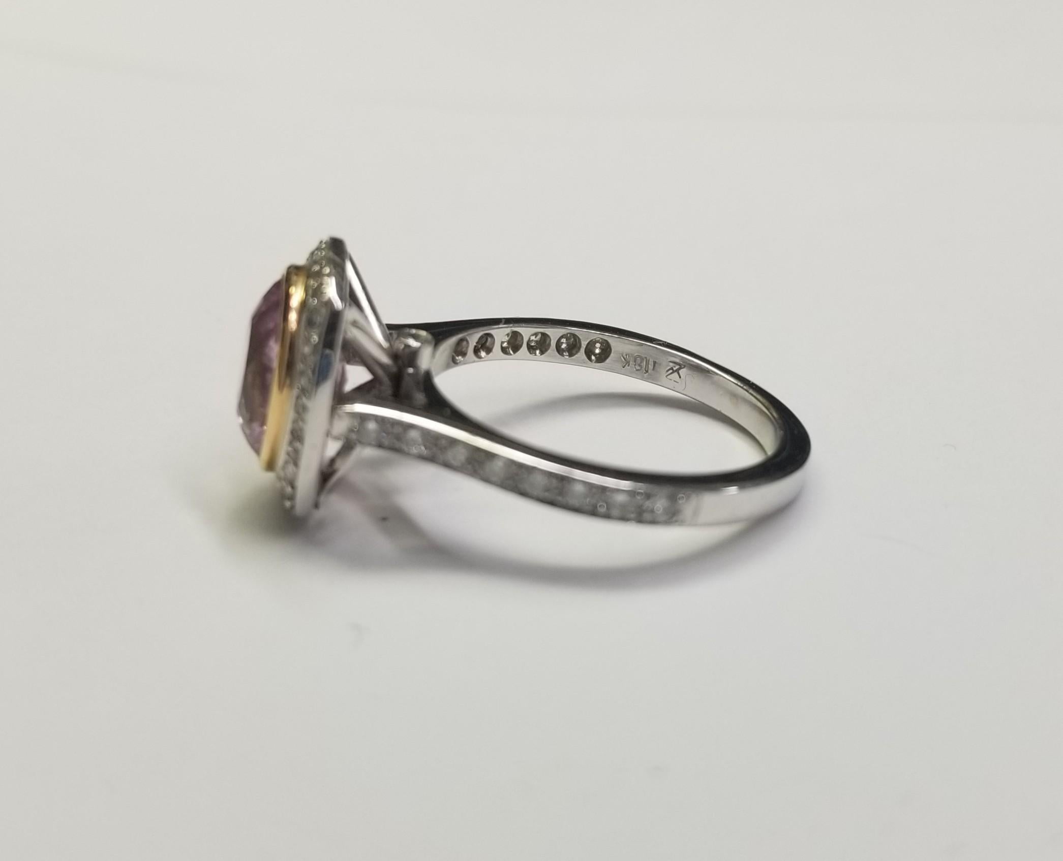 Specifications: 
    Metal: Platinum
    Weight: 7 Gr
    Main Stone: Pink Sapphire 2.67cts.
    Side Stones: 48 Diamonds    
    Weight: .40pts.
    Color: G
    Clarity: VS
    Size: 7 US






