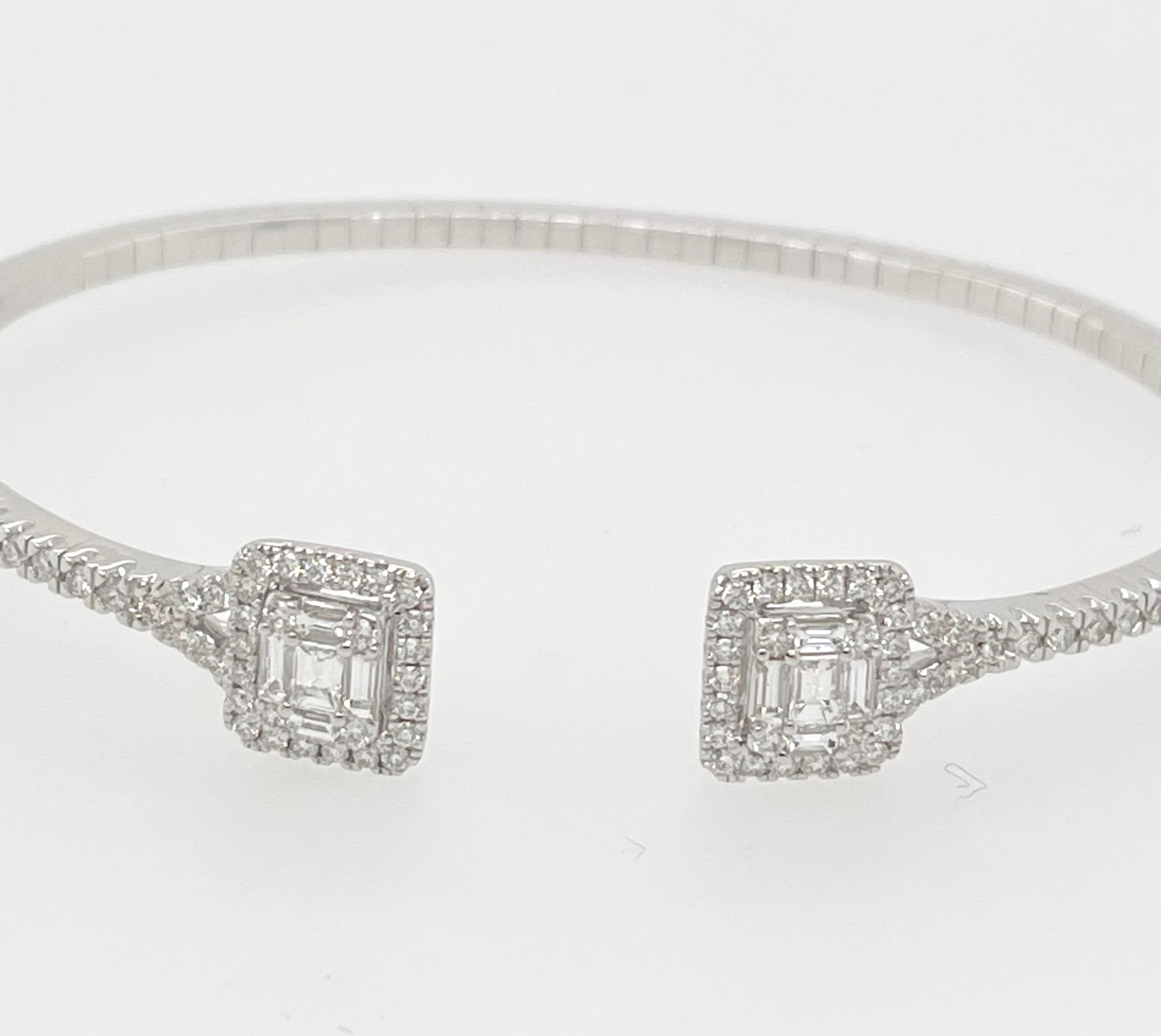 A stunning White Diamond Bangle Bracelet set in 18K White Gold accompanied by 1.28 carats of white round diamonds and emerald cut diamonds. 