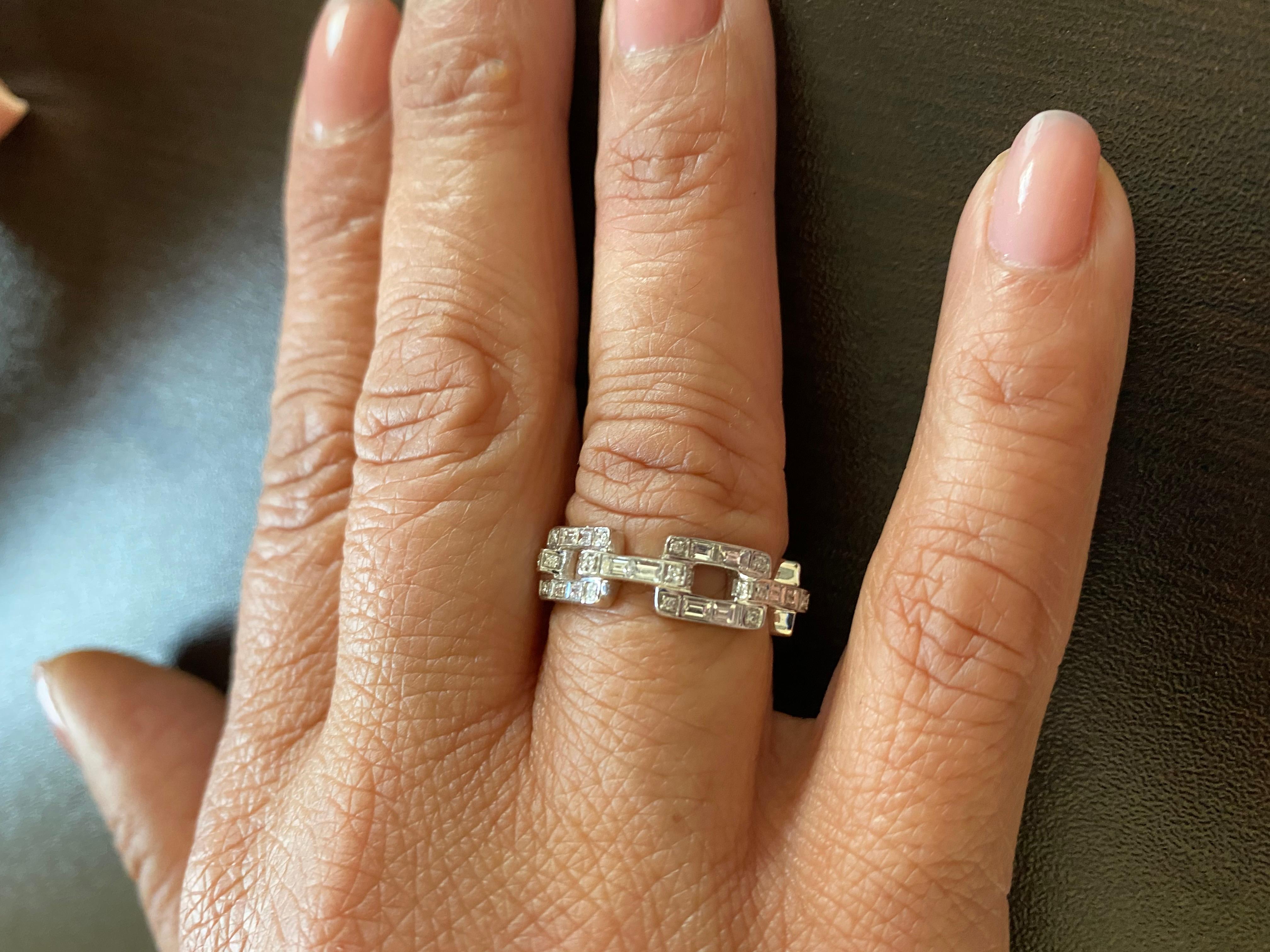 Diamond link ring set in 18K white gold. The ring is set with baguette and round diamonds. The total weight is 1.59 carats. The color of the stones are F, the clarity is VS1. The ring is a size 7.