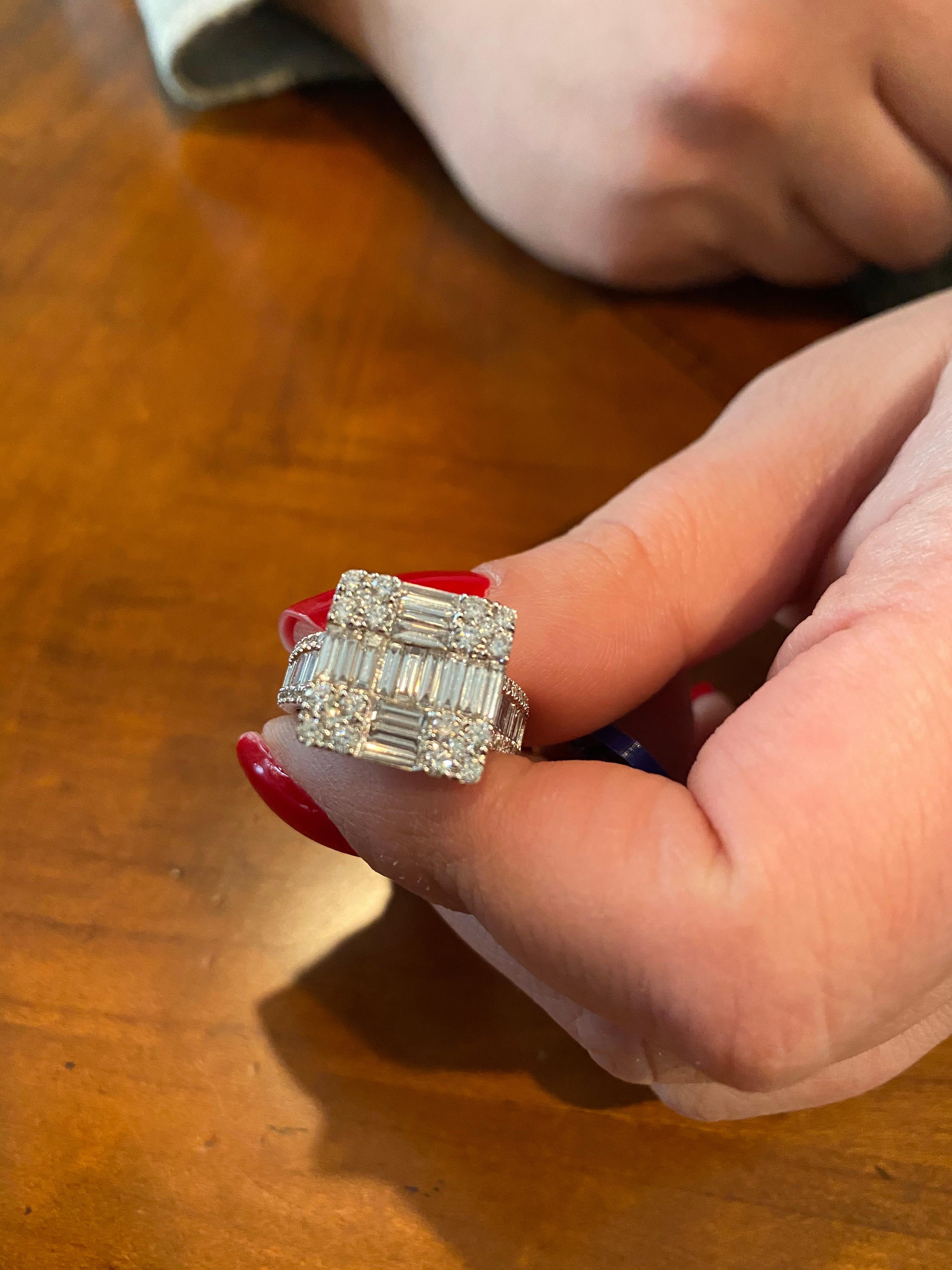 Baguette and round diamonds set in 18K white gold that create the illusion of a single emerald cut cocktail ring. The total carat weight is 1.62. The color of the stones are F, the clarity is VS1. The ring is a size 6.5