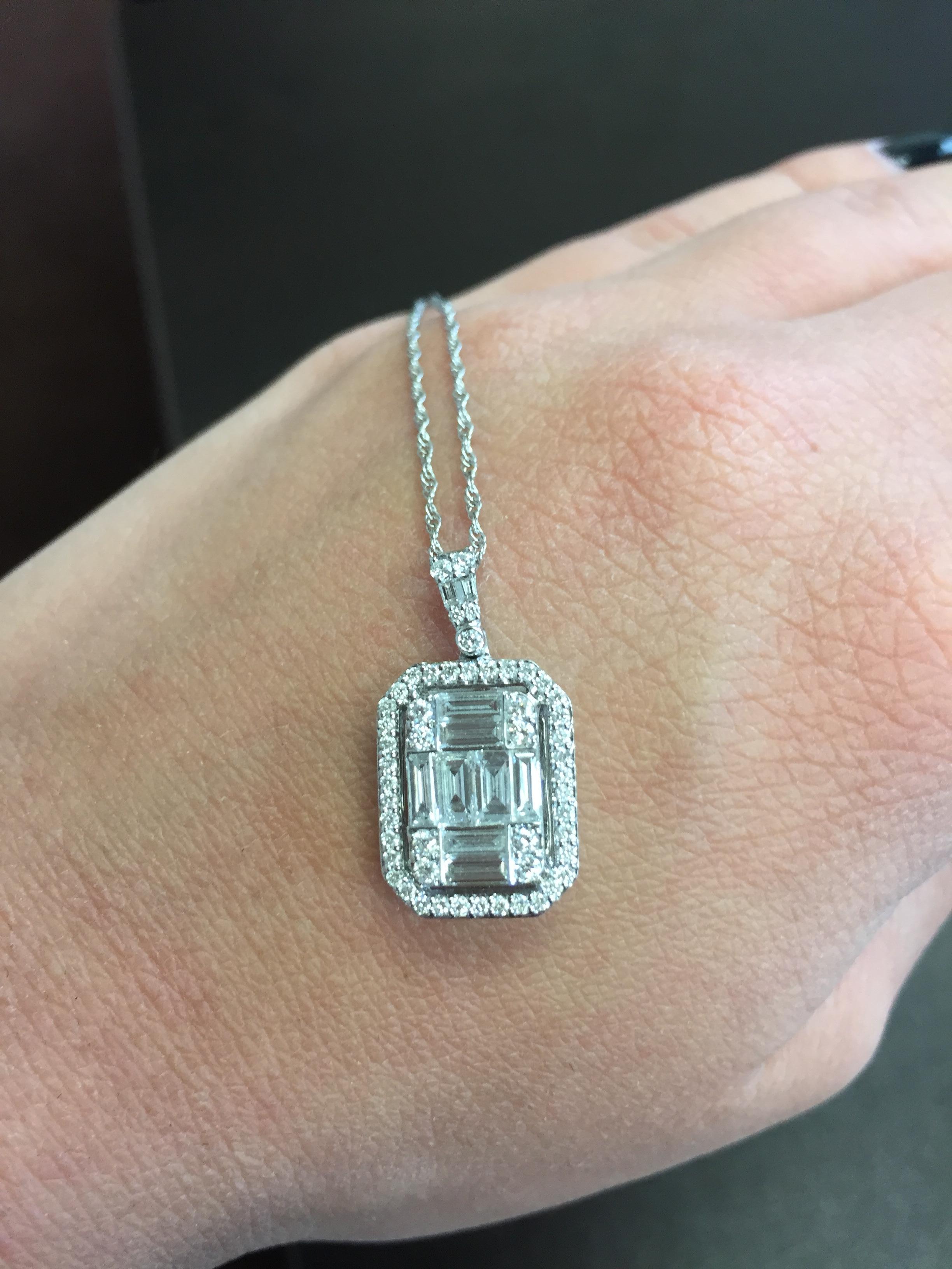 Emerald Cut Pendant with Halo set in 18K gold. The total weight is 1.61 carats. 
Stone color is F
Stone clarity is VS-VS2. 
