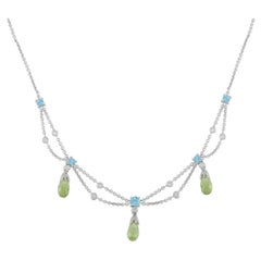 Collar de oro blanco de 18 quilates con 0,20 ct de diamantes, topacio y peridoto MF01-070825