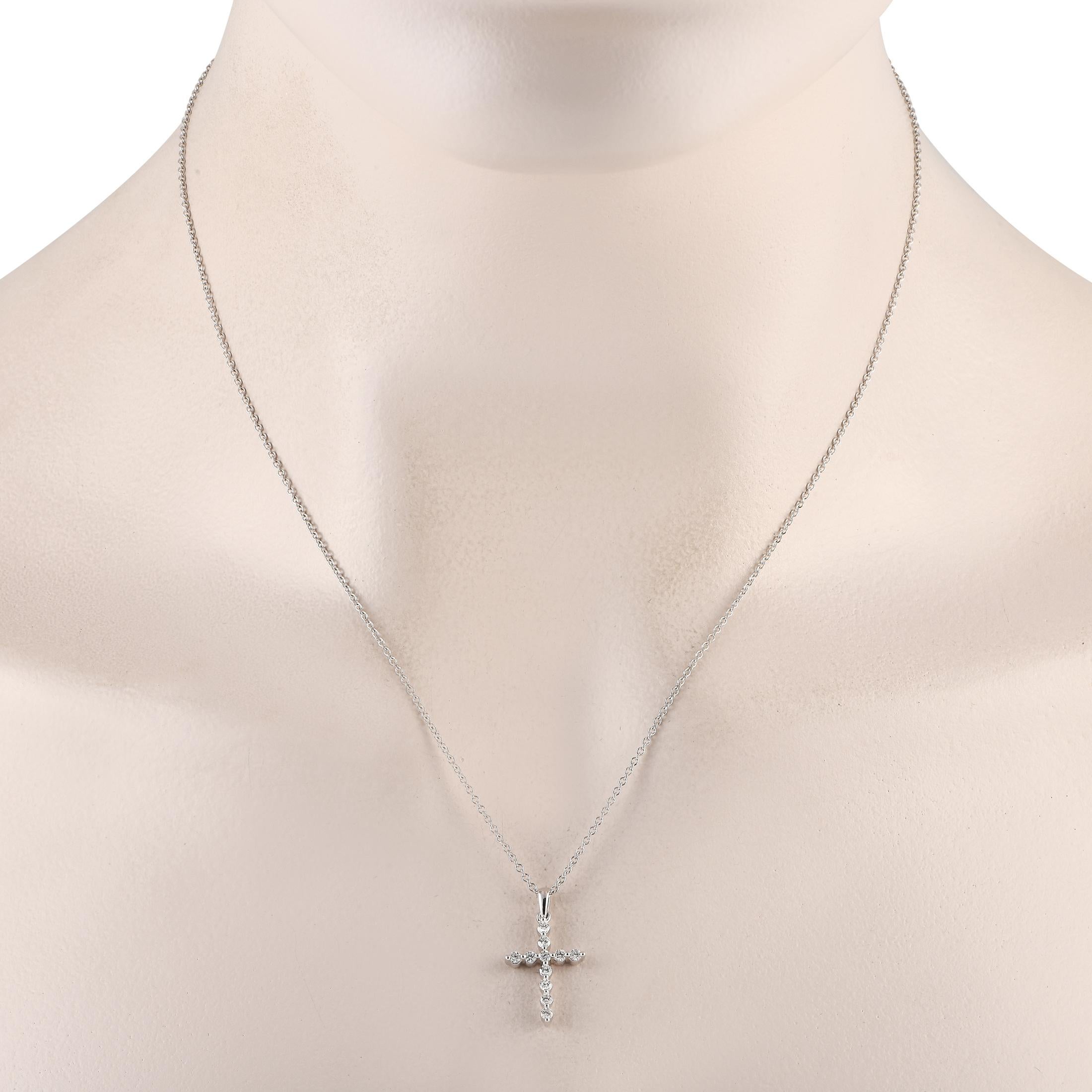 Let your belief shine through this radiant necklace. It features a 0.75 by 0.50 cross pendant detailed with 11 round brilliant diamonds. The necklace comes with a delicate, barely-there chain which makes this piece perfect for layering.This brand
