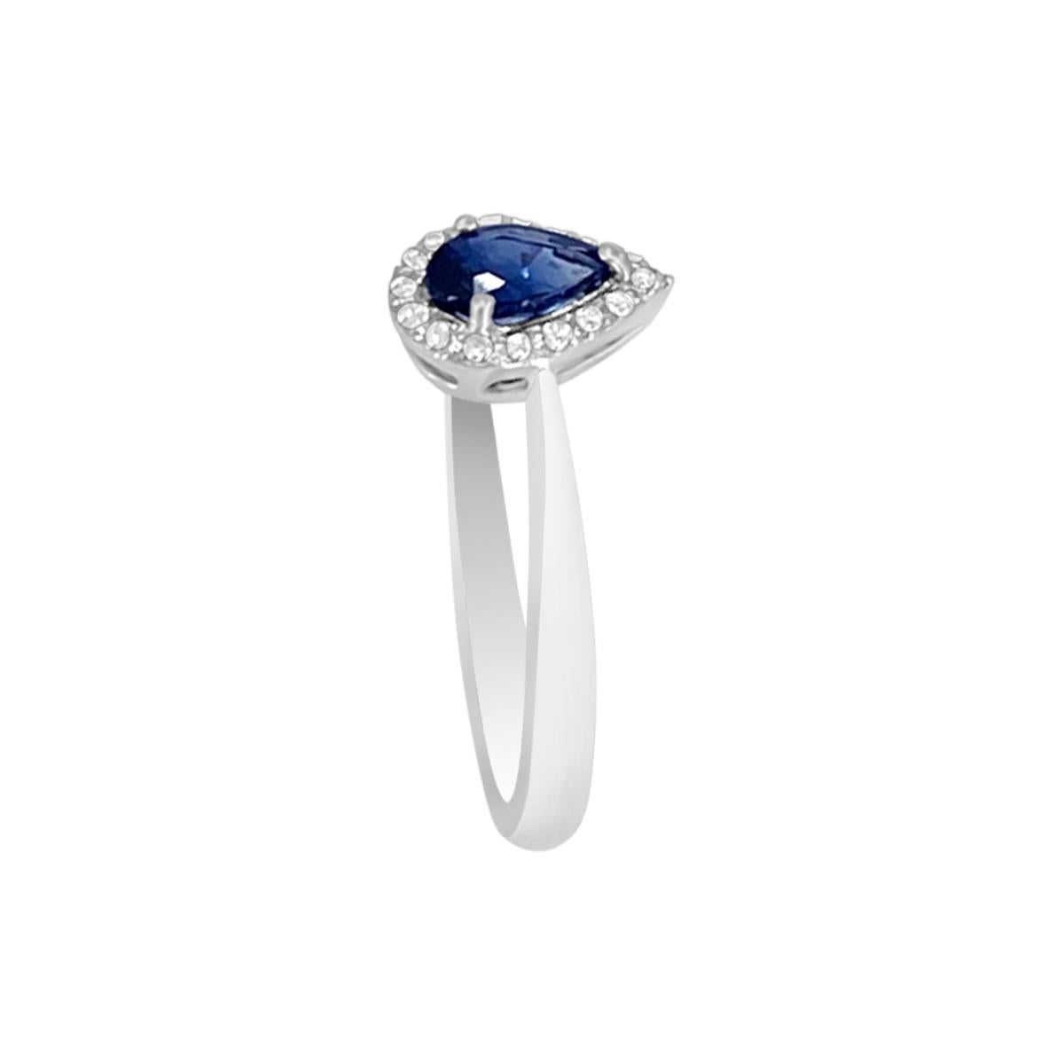 This Stunning Piece Of Jewelry Features A Pear Shaped Sapphire Gemstone With Diamonds Studded In 18K White Gold. The Sapphire Ring Is Designed To Bring Harmony To Your Everlasting Relationship. Make Your Partner Feel More Special On A Special Day