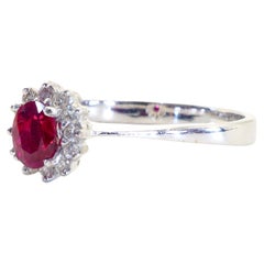 18K White Gold 0.62ct Oval Deep Red Ruby & 0.20ct Diamond Halo Ring