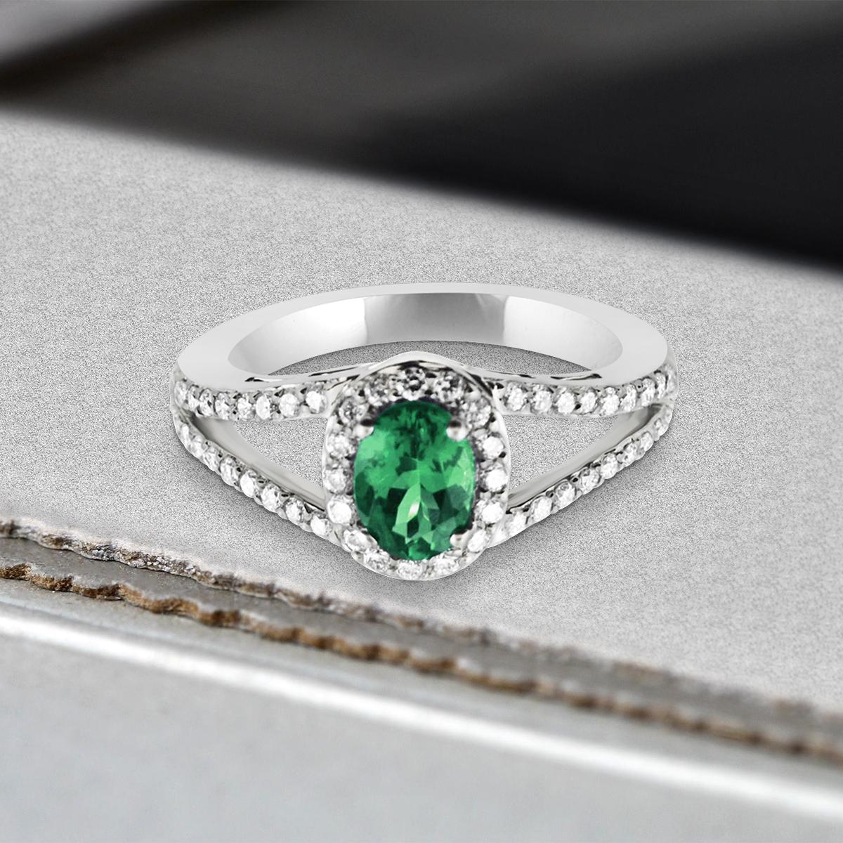 The Emerald Gemstone And Diamond Halo Ring Is Full Of Refined Elegance!
This Rare Variety Of Emerald Is A Rich, Forest Green Hue That Has A Sophisticated Sparkle And Pairs Beautifully With The Warmth Of The 14k White Gold Mounting. A Frame Of