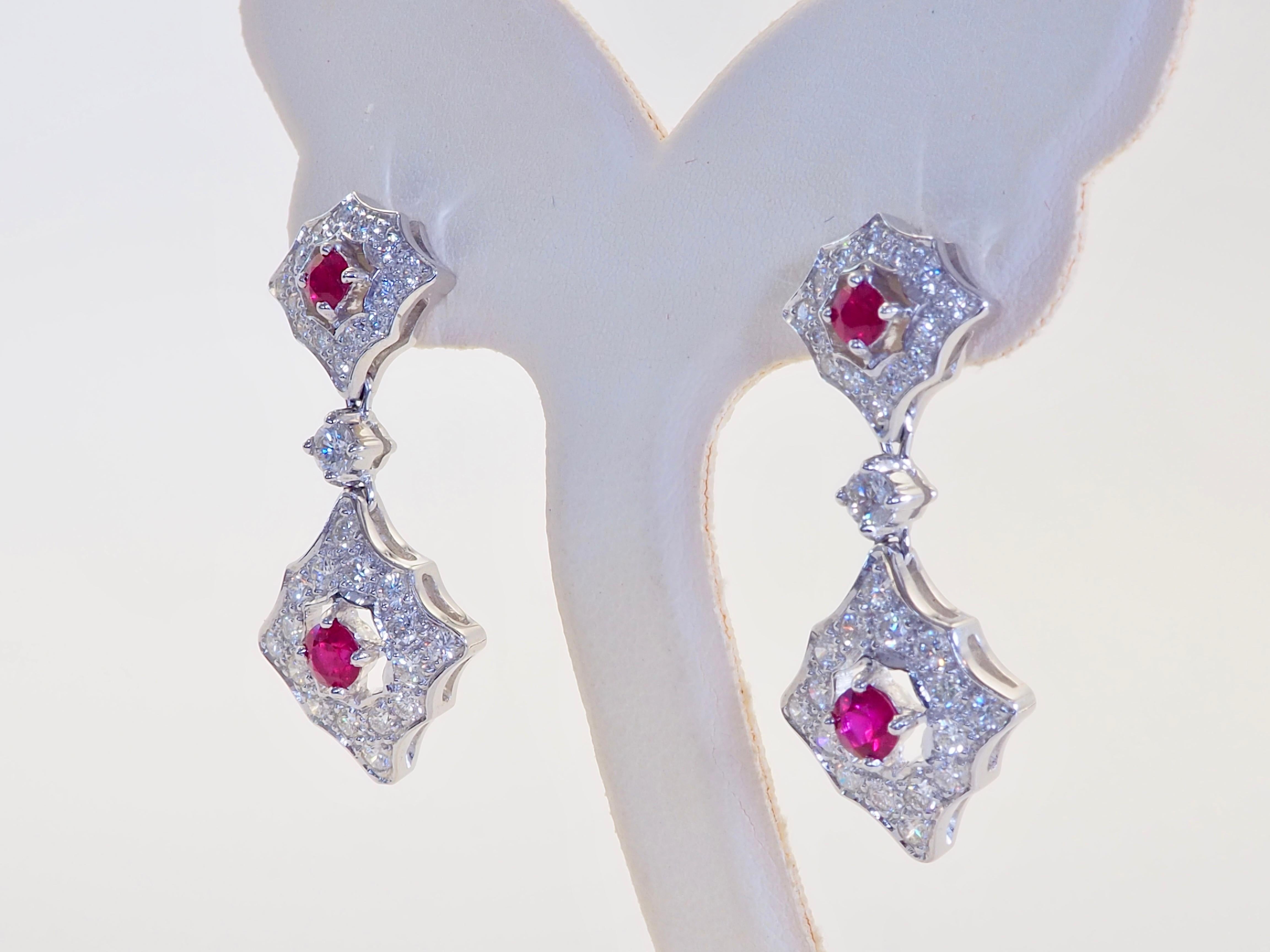 Meticulous work from a renowned designer and craftsman from Hong Kong. The joints are movables. The rubies are bright with pinkish-red hue and diamonds are of varying sizes, but all are bright and very clean. This wonderful piece is for keepsake and