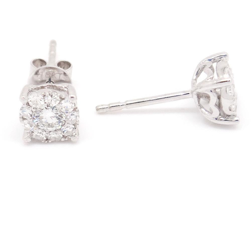 18k White Gold 0.75tcw Flower Cluster Diamond Stud Earrings
Dimensions: 15.6mm by 8mm
Metal: 18k white gold
Clarity: Si1-Si2
Color: G-H
TCW: 0.75
Stone:  Diamonds,
Stone Shape: Rounds 
Weight: 1.6g