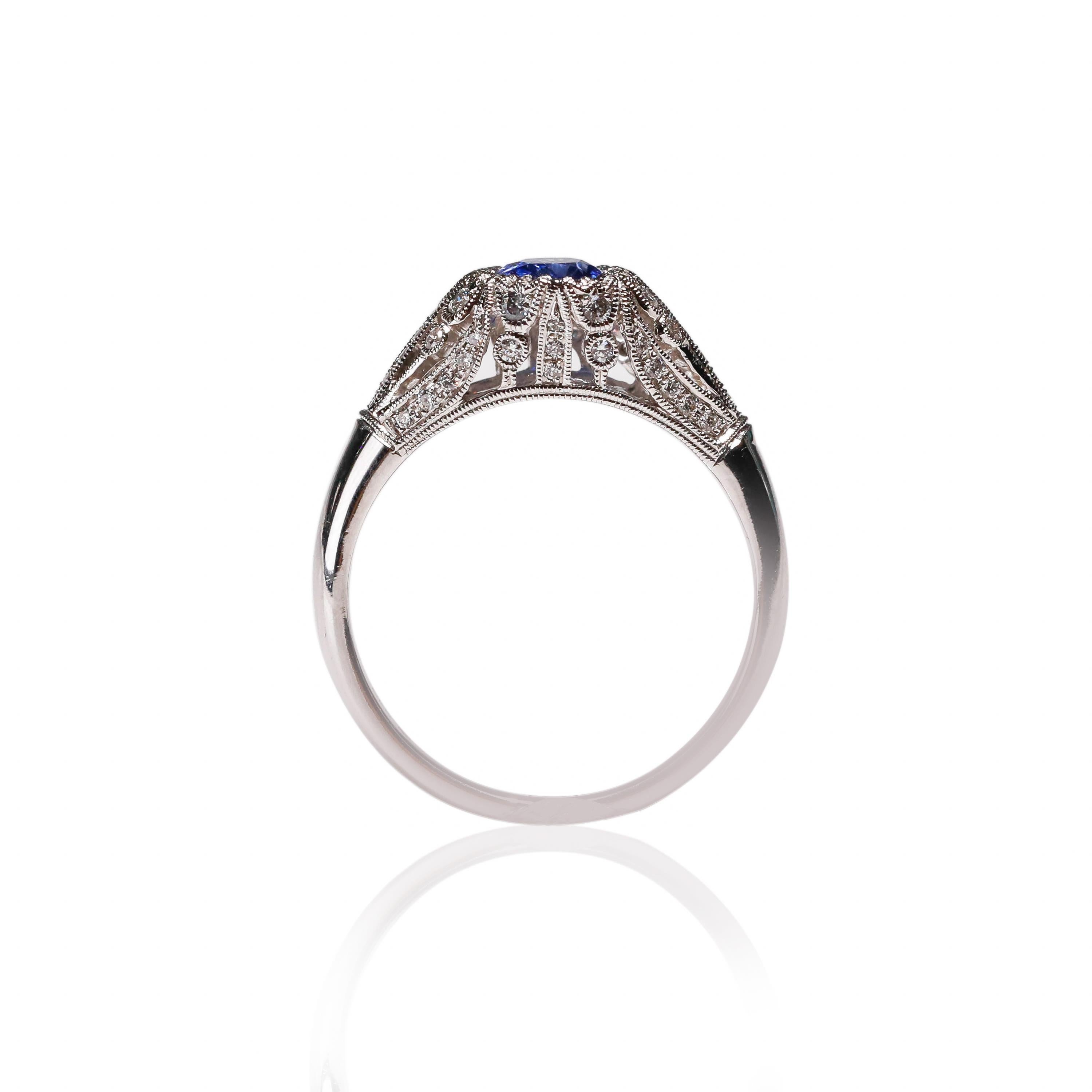 18k White Gold 0.77 Carat Oval Cut Blue Sapphire Diamond Halo Ring New Art Deco Style Size US 6.5

Crafted in 18 kt White Gold, this Unique design showcases a Blue Sapphire 0.77 TCW Oval shaped 7x5mm Sapphire, set in a halo of round-cut mesmerizing