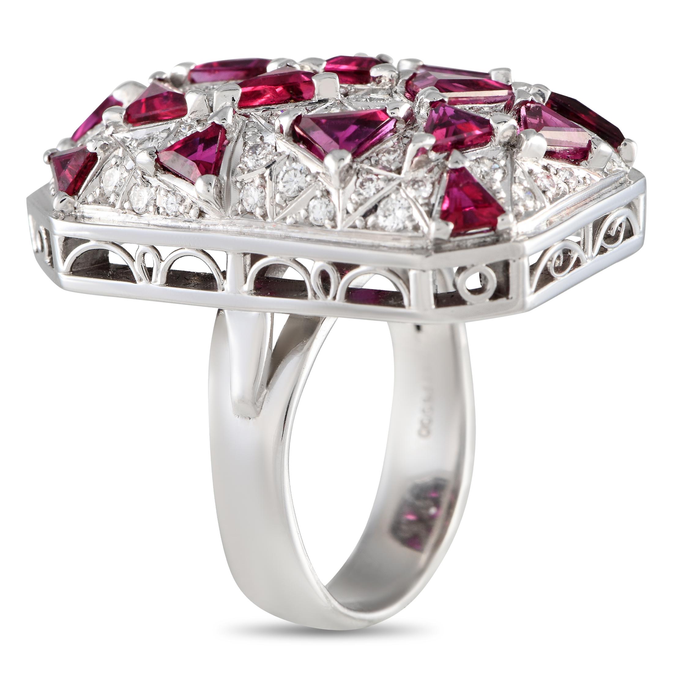 Adding this ring to your ensemble is a quick way to give it a larger-than-life finish. This statement ring features a polished 18K white gold shank topped with a geometric cluster of glitter. The convex centerpiece features fancy-cut rubies