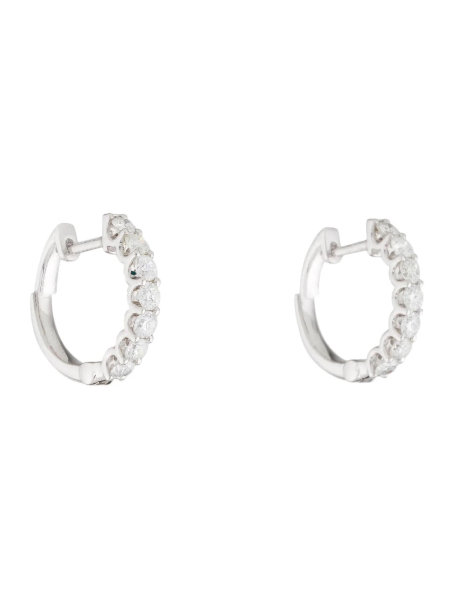 Give any outfit a glamorous flair with this pair of brilliant small thin hoop earrings from the Joelle Collection Encrusted with 0.80ct of exquisite round-cut white diamonds, these earrings add a playful sparkle to any look. The high polish 14k gold