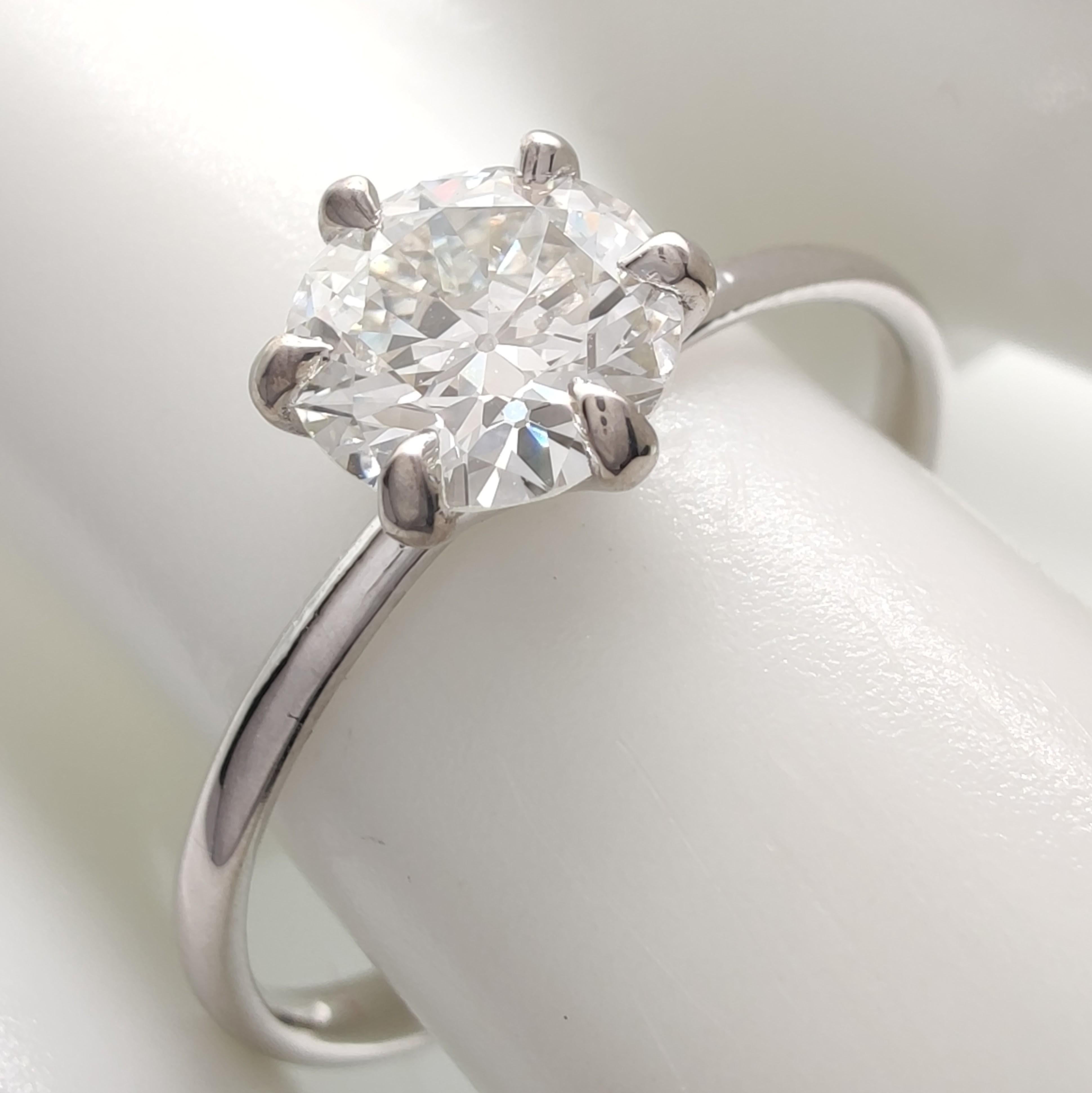 This exquisite 18K white gold solitaire ring is a timeless statement of elegance. Handcrafted with precision, it features a 0.80ct natural round brilliant diamond (H-I color, VS2 clarity, very good finish) securely set in a six-prong mount,