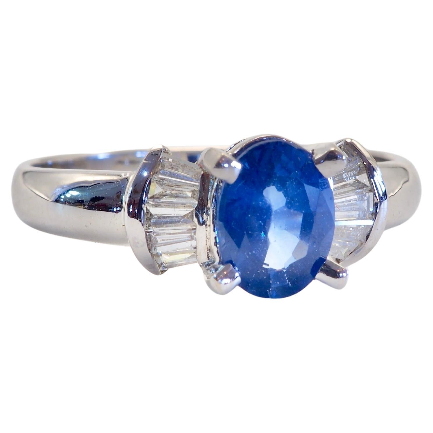 Cute bow tie design ring equipped with good grade, eye-clean Ceylon Cornflower blue sapphire and 10 decent size tapered baguette diamonds. Wide band allow for comfort and protection. For those who loves the best of sapphires.

-Big clear and lively