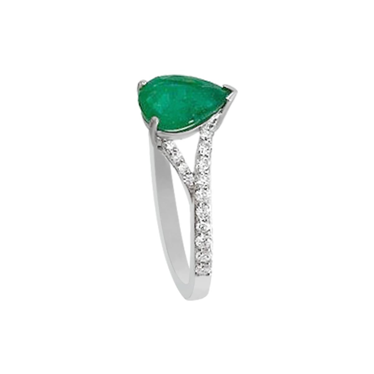 This Rich And Sophisticated Design Features A Center 8X6mm Pear Shape Elegant Emerald Gemstone Surrounded By Prong Set Diamonds.
This Gorgeous Ring With Emerald Gemstone Is Crafted Beautifully In 18K White Gold Mounting.


Style# TS1024R
Emerald :