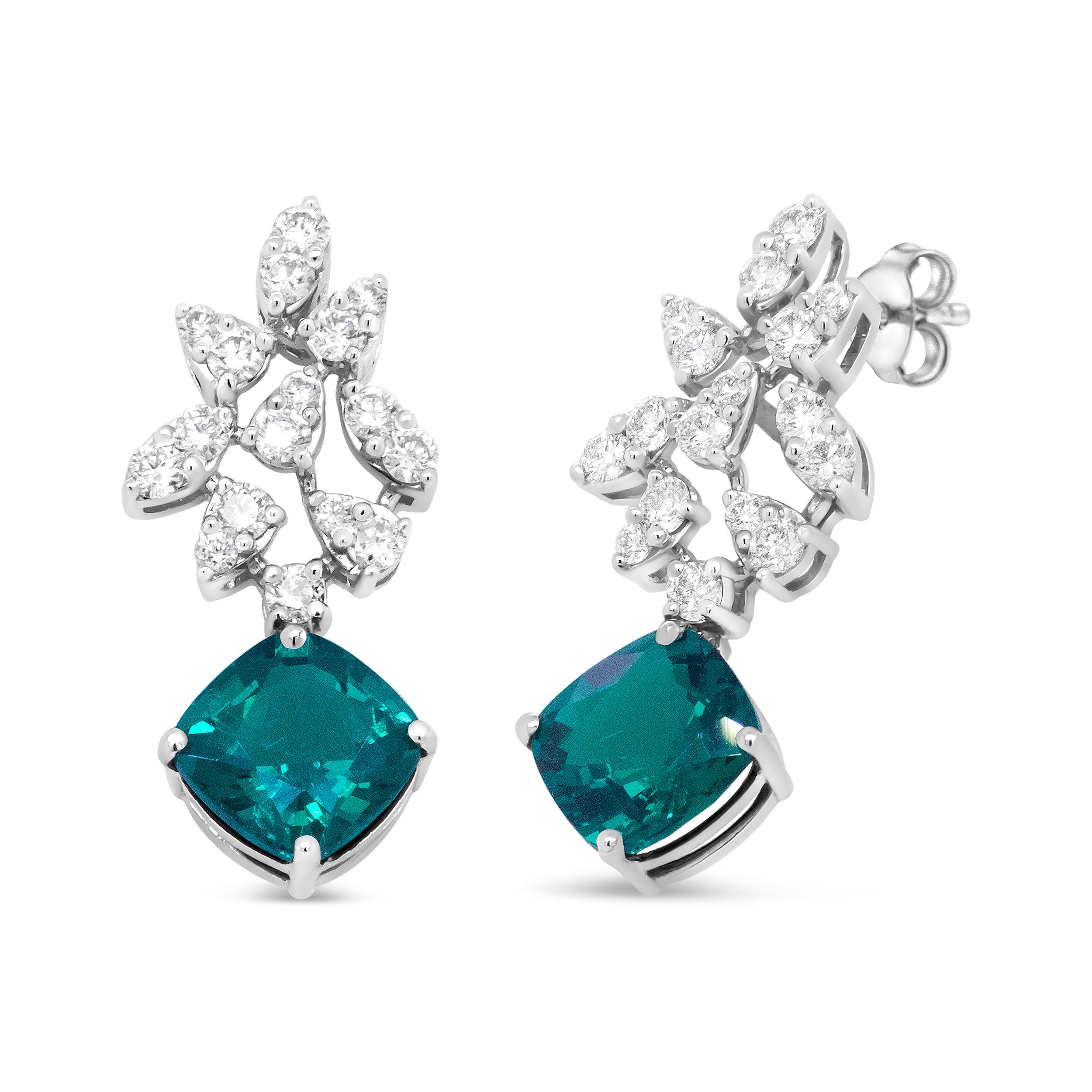Elevate your style with the rich sparkle that gleams from these gemstone and diamond drop earrings made from genuine 18k white gold. The upper dangle of this brilliant pair is illuminated with the alluring shine of round, prong set diamonds paired