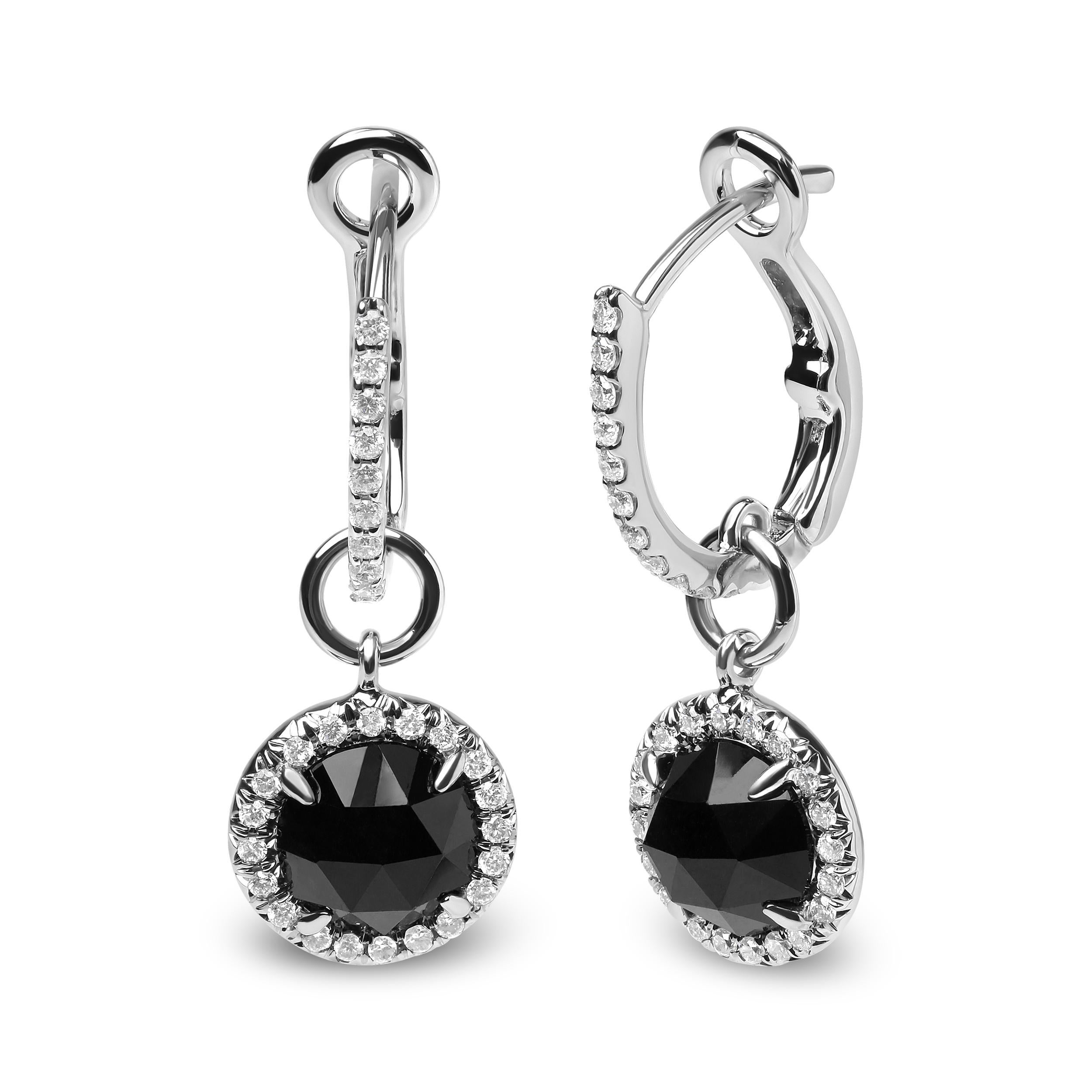 A tremendous level of sparkle emanates from these 18k white gold dangle hoop earrings. Set with natural 7mm round heat-treated black onyx at the center of each earring, these prong set gemstones are complemented by the a glamorous halo of round