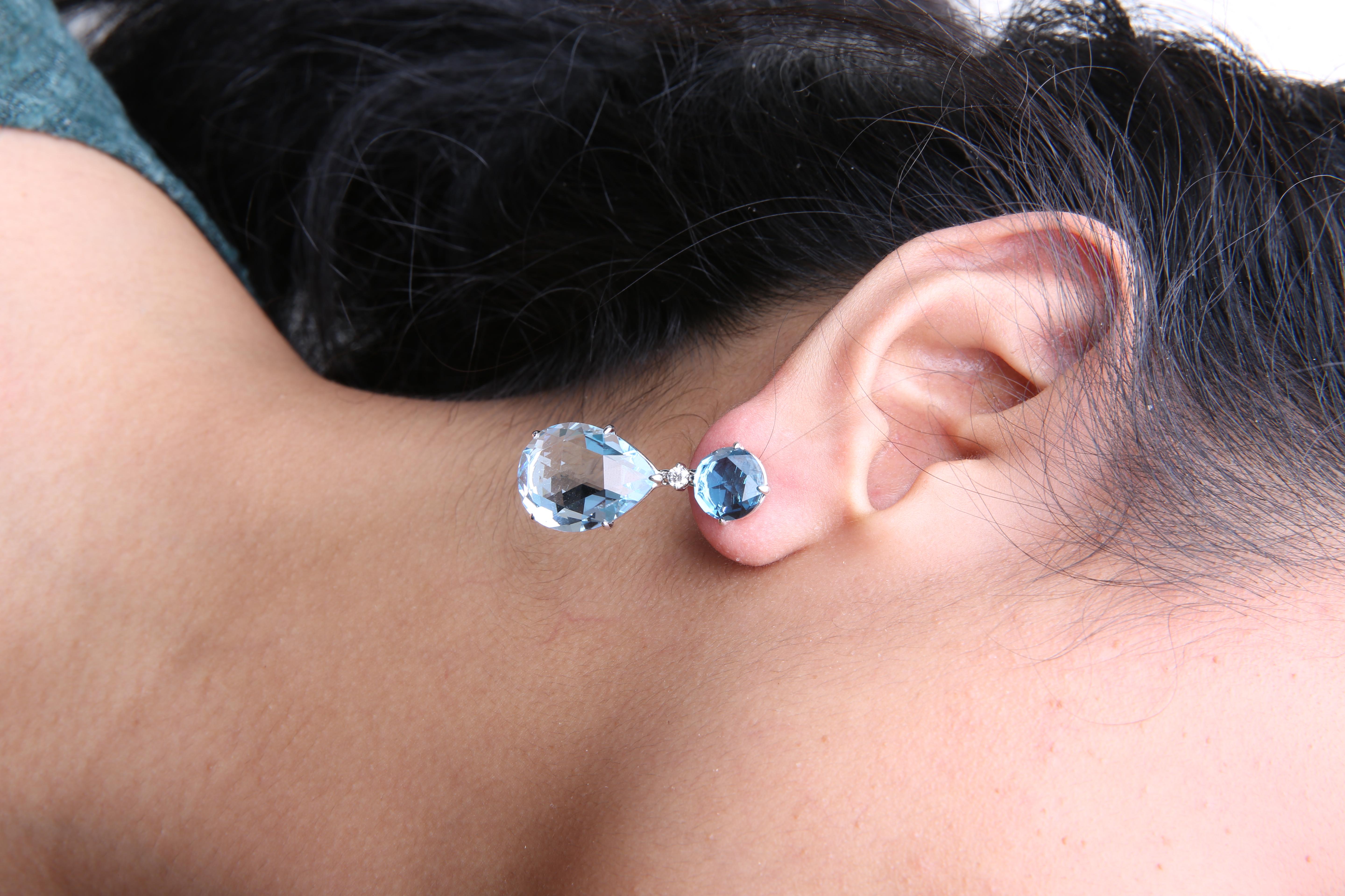 Round Cut 18K White Gold 1/5 Carat Diamond with Round and Pear Blue Topaz Dangle Earrings For Sale