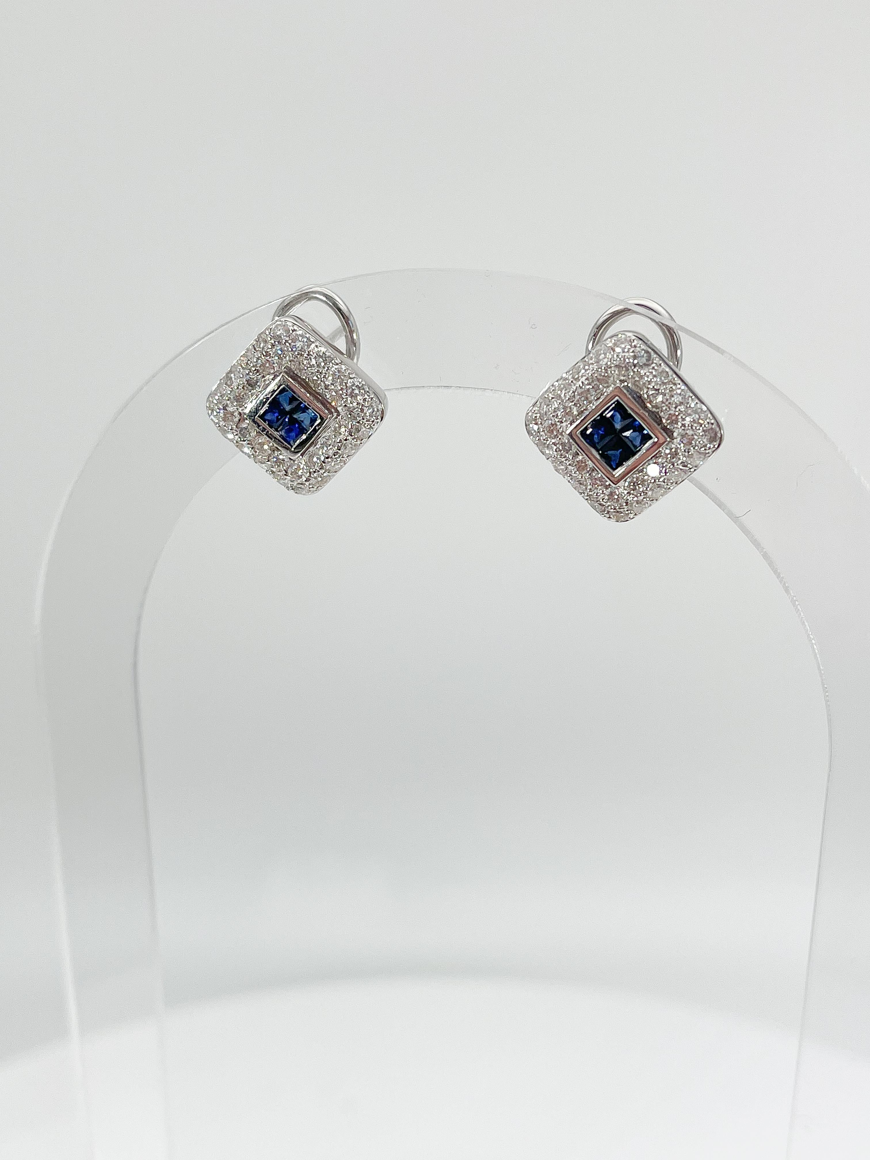 18k white gold 1 CTW sapphire and 1 CTW diamond earrings. The sapphires are princess cut, and the diamonds are all round, they measure to be 15.6 x 15.6 mm, they have a lever back to open and close, and a total weight of 7.4 grams.