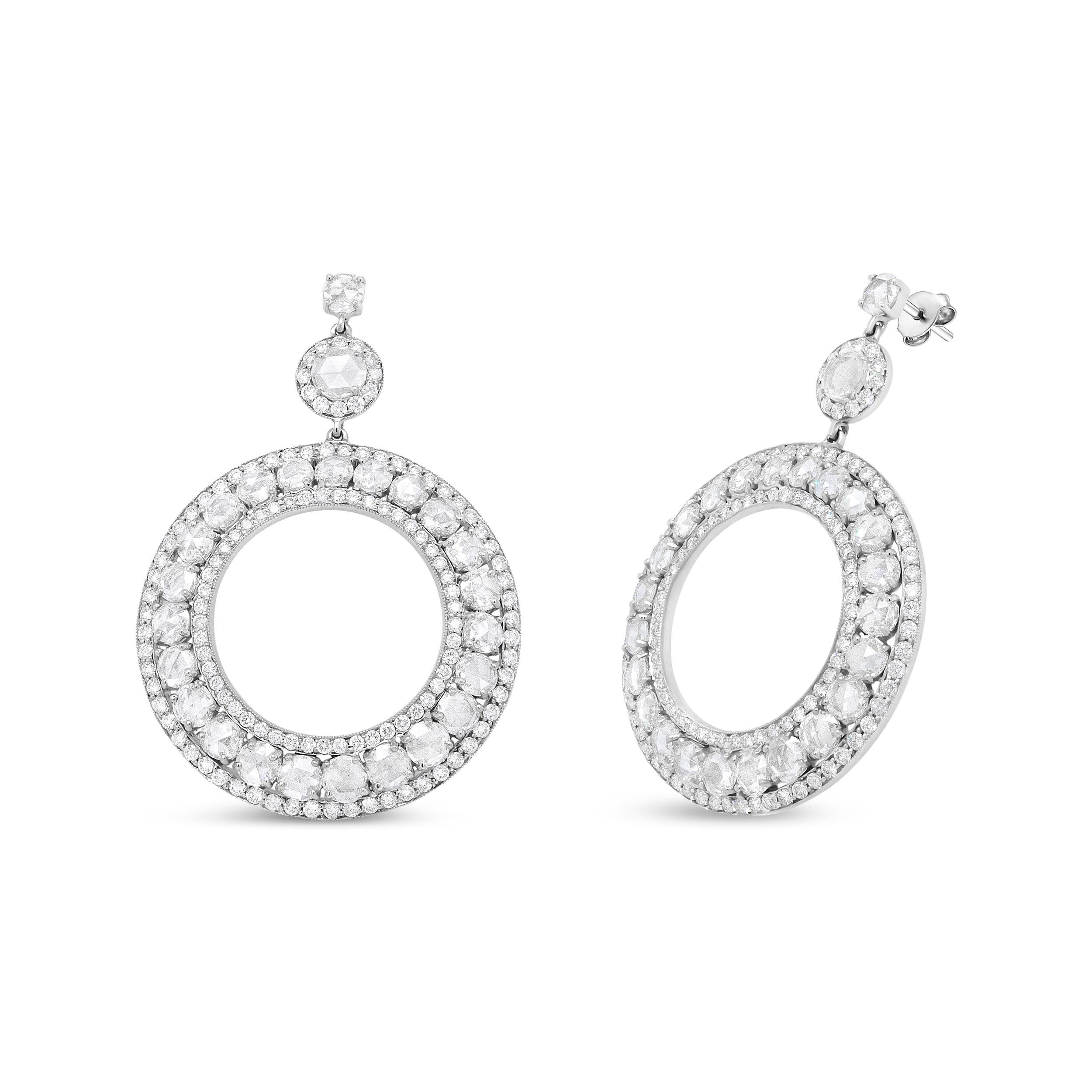 Turn heads in this forward-thinking pair of diamond earrings for her. This classic yet modern pair emulates elegance in its most contemporary form, evocative and artfully formed in an openwork circle silhouette. Pave-set round diamonds are