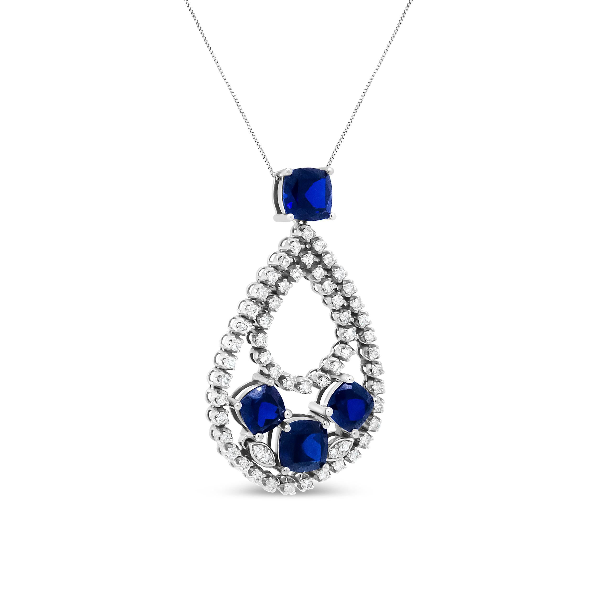 An sophisticated addition to your outfit, this 18k white gold pendant necklace adds a hearty dose of sparkle at every turn. The design starts with a bail embellished with a cushion-shaped sapphire in a color-treated blue color. An double openwork