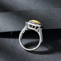 1.007 Carat Vivid Yellow Diamond Ring with Tapered Baguette Cut Diamond Around