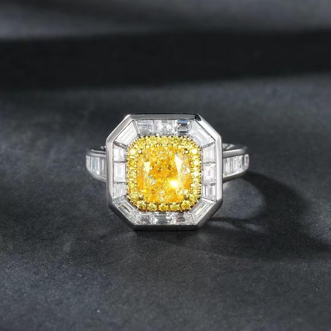 Cushion Cut 1.007 Carat Vivid Yellow Diamond Ring with Tapered Baguette Cut Diamond Around For Sale