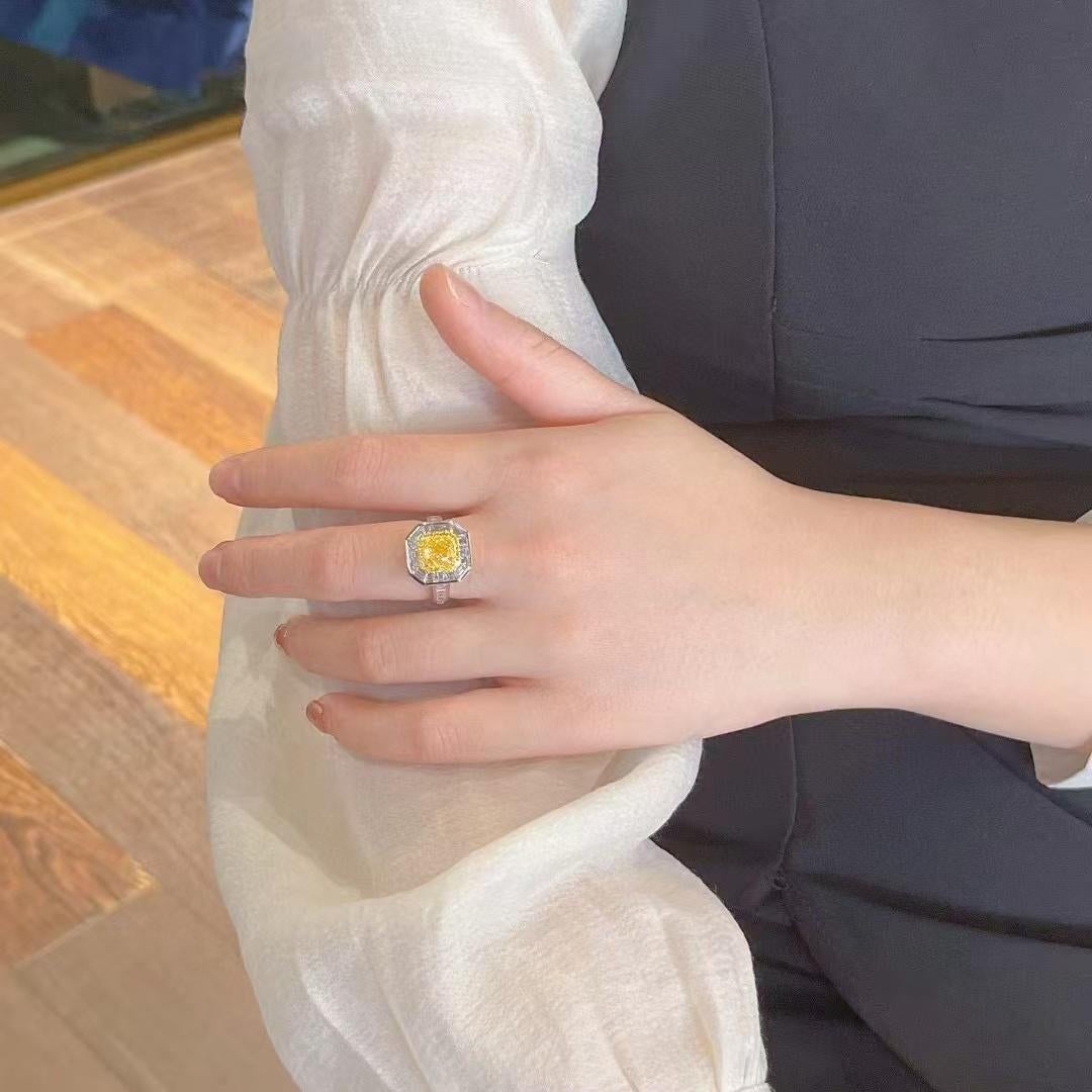 1.007 Carat Vivid Yellow Diamond Ring with Tapered Baguette Cut Diamond Around In New Condition For Sale In Kowloon, HK