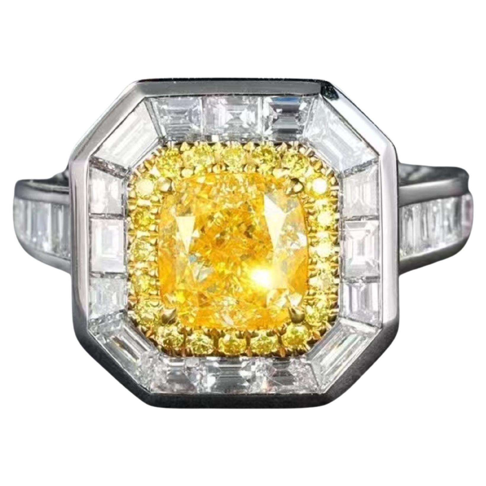 1.007 Carat Vivid Yellow Diamond Ring with Tapered Baguette Cut Diamond Around For Sale