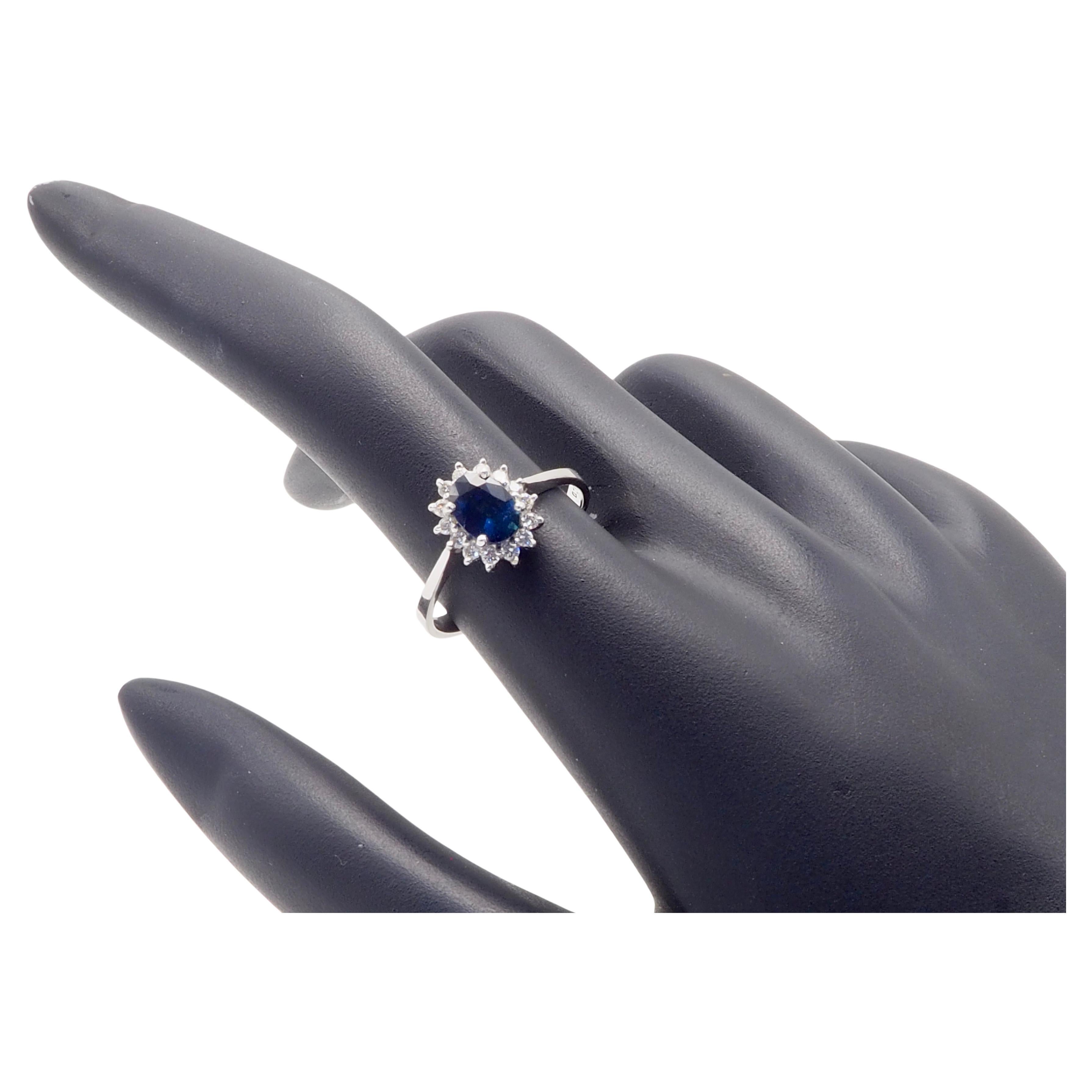 A fine Thai blue sapphire ring in a contemporary sunburst halo design. Very clean sapphire with awesome blue color and a green tint with high clarity and surrounded by brilliant and decent size diamonds. Perfect for wearing every day. 

Product