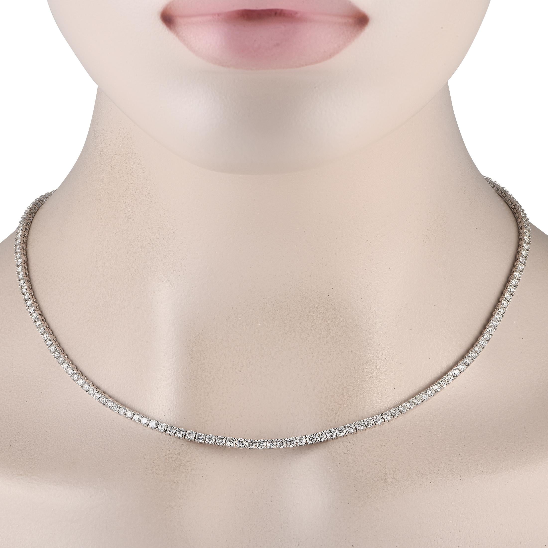Your new favorite necklace. This jewel captures attention with its never-ending row of sparkle. The 18-long necklace features a line of round diamonds totaling 10.47 carats.This 18K White Gold 10.47 ct Diamond Tennis Necklace is offered in brand new
