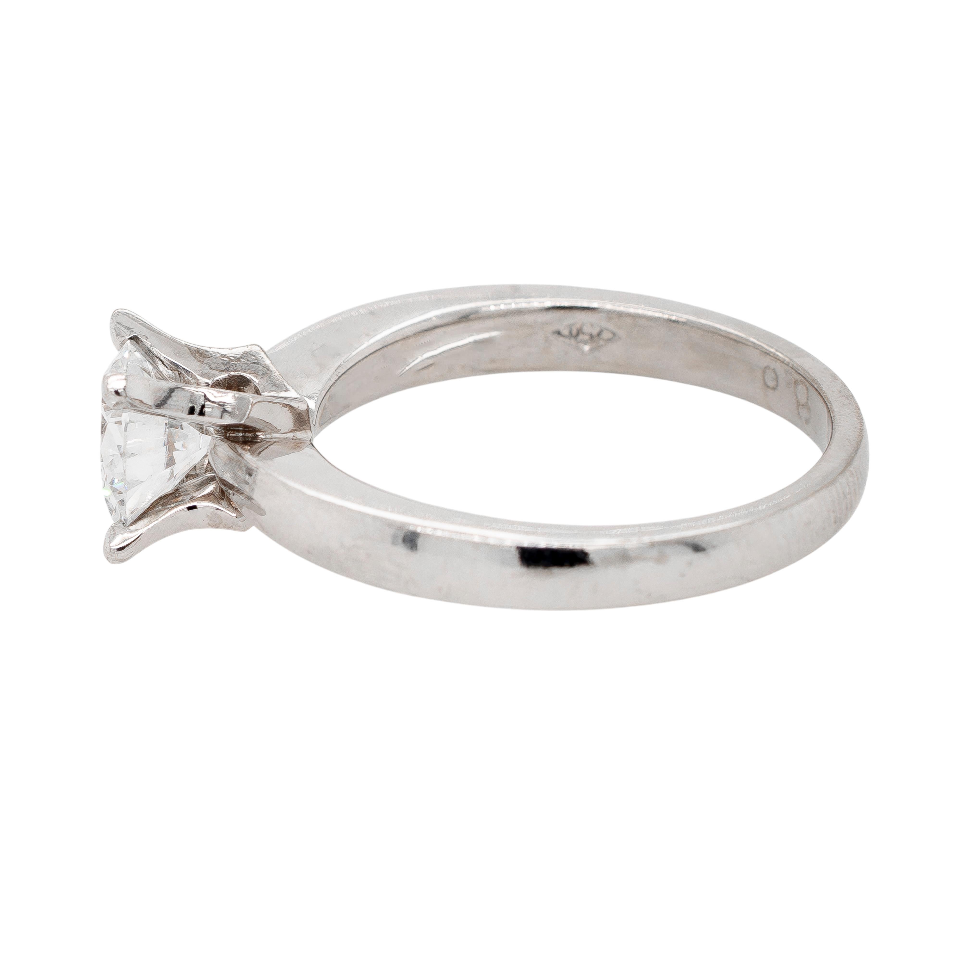 This elegant 18k white gold engagement ring features a dazzling 1.05-carat round brilliant diamond, graded E color and VS1 clarity by GIA. The diamond's exceptional brilliance and near-flawless clarity make it a standout centerpiece, perfectly set