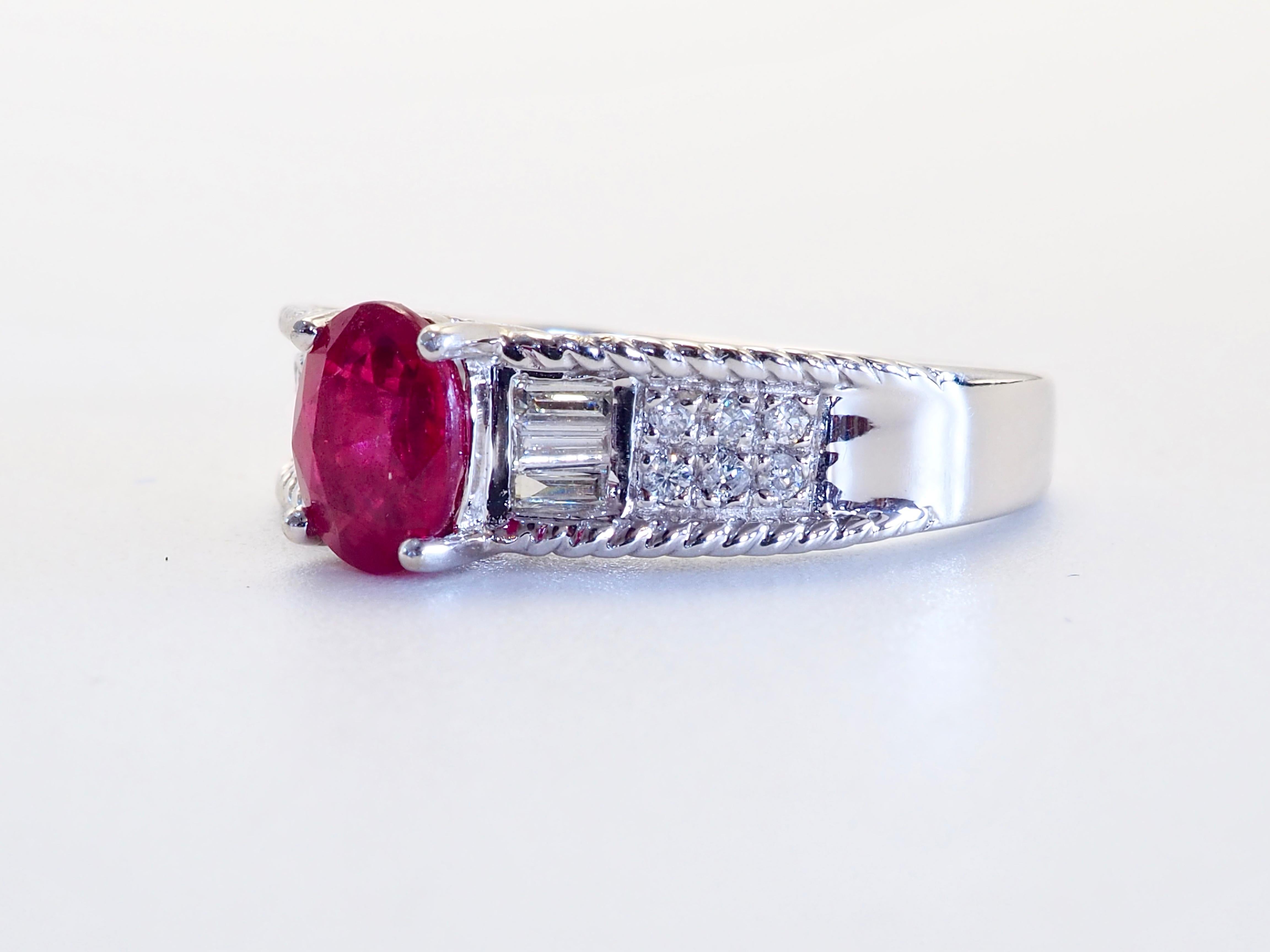 This wonderful ring boasts a saturated color oval cut Myanmar ruby of 1.07 carats. The stunning oval cut ruby has natural inclusions of a heat-treated ruby. The baguette and brilliant pave diamonds are set neatly and their clarity and color is of