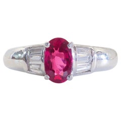 18K White Gold 1.07ct Oval Ruby 
0.24ct Baguette Diamond Band Ring