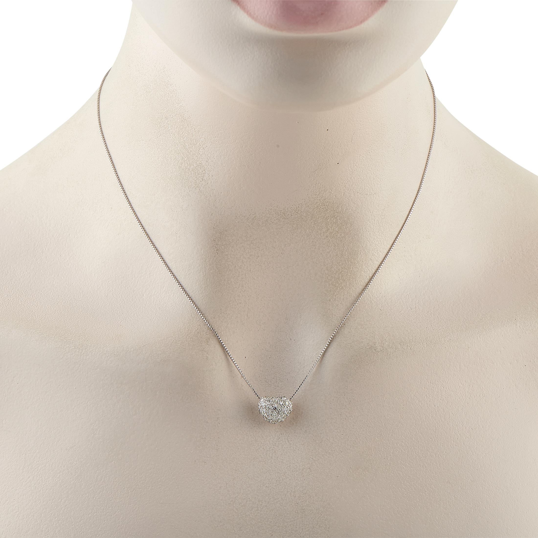 An piece that captures a lifetime of light and love. It features a box chain holding a heart pendant blanketed in 1.0 carat of brilliant pav diamonds. The petite stones create a seamless sheet of sparkle, ensuring maximum brilliance from every